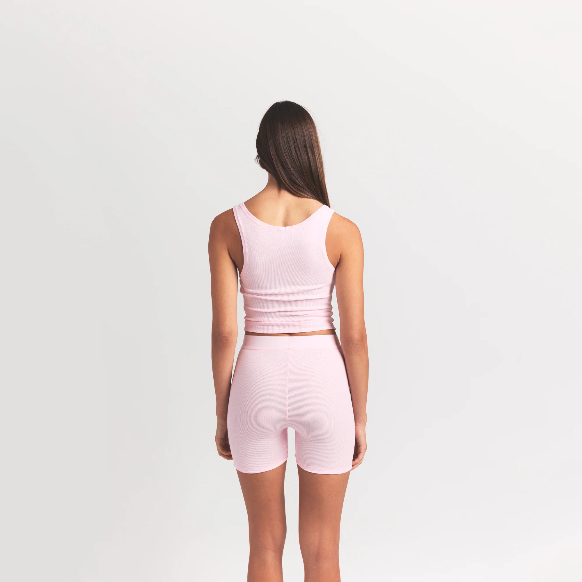 COTTON RIB TANK | CHERRY BLOSSOM ON A MODEL BACK VIEW @ | FOCUS: 0.9, 0.1, 0.7