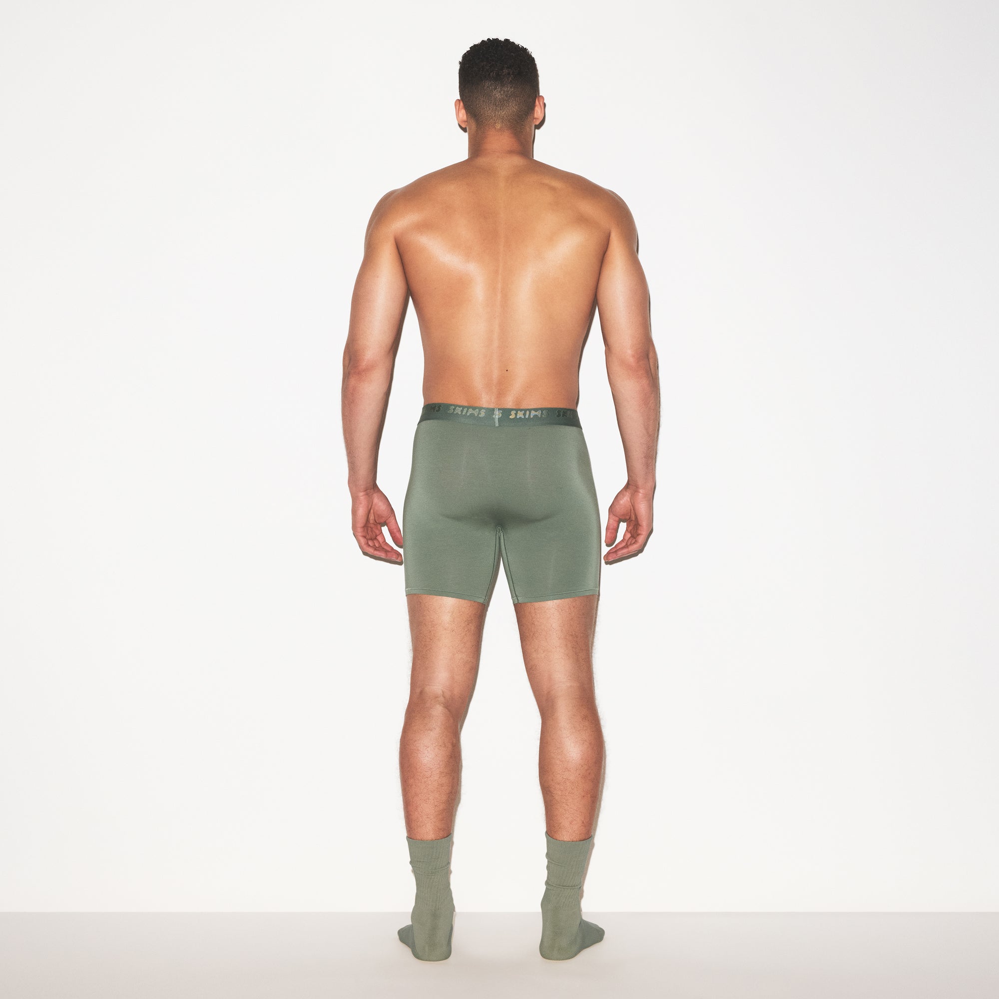 SKIMS STRETCH MENS 3 INCH BOXER BRIEF 3-PACK | LAUREL MULTI ON A MODEL FRONT VIEW | FOCUS: 0.0, 1.0, 0.9