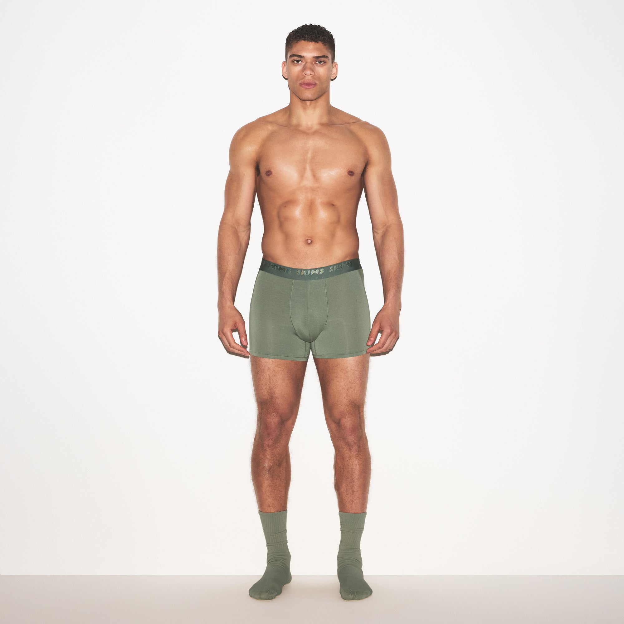SKIMS STRETCH MENS 3" BOXER BRIEF 3-PACK | LAUREL MULTI ON A MODEL FRONT VIEW | FOCUS: 0.0, 1.0, 0.9