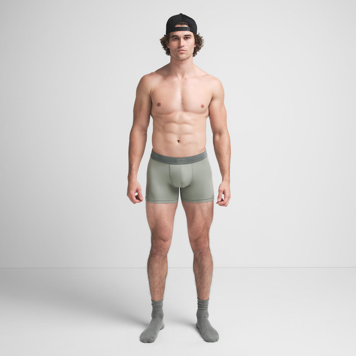 SKIMS COTTON MENS 3" BOXER BRIEF 3-PACK | STONE MULTI ON A MODEL FRONT VIEW @ | FOCUS: 0.9, 0.1, 0.7
