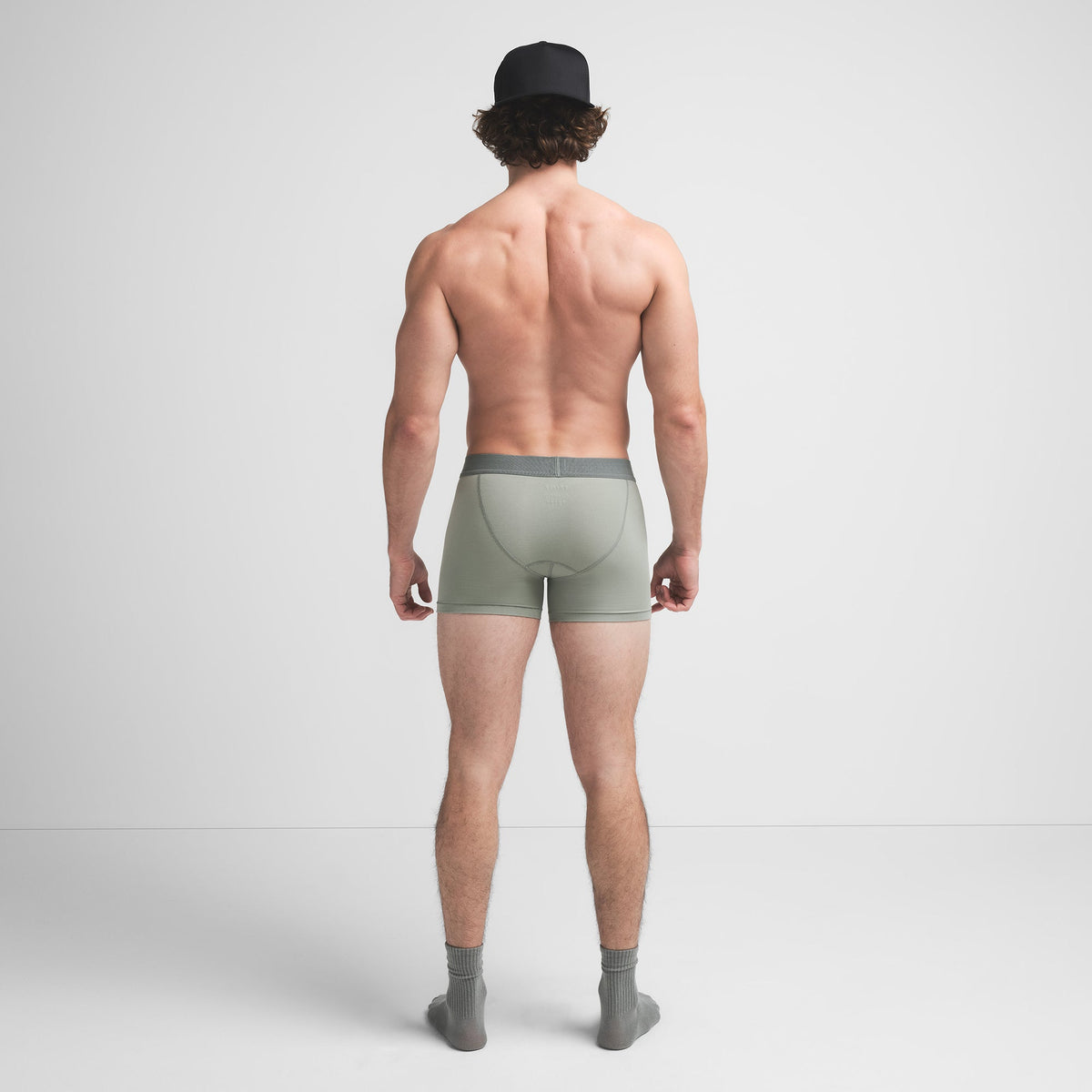 SKIMS COTTON MENS 3" BOXER BRIEF 3-PACK | STONE MULTI ON A MODEL BACK VIEW @ | FOCUS: 0.9, 0.1, 0.7