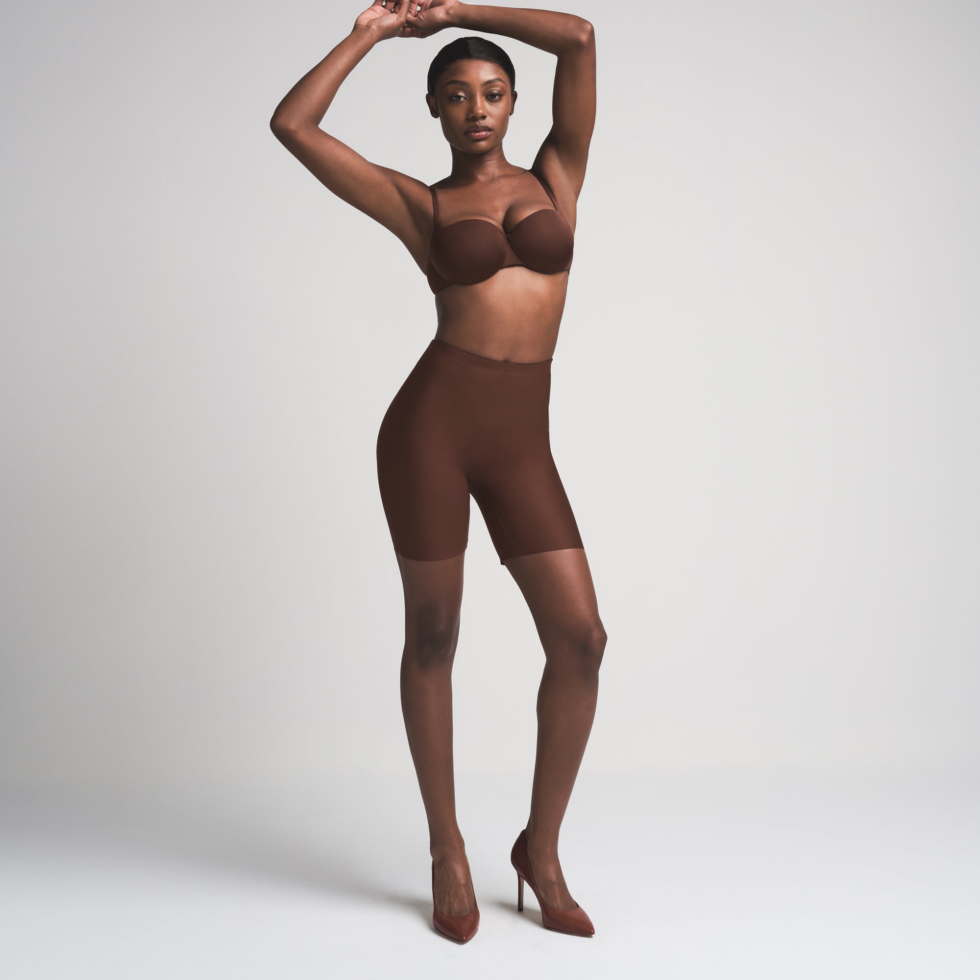 SKIMS BODY BUTT ENHANCING PADDED SHORT | COCOA ON A MODEL FRONT VIEW | FOCUS: 0.0, 1.0, 0.9