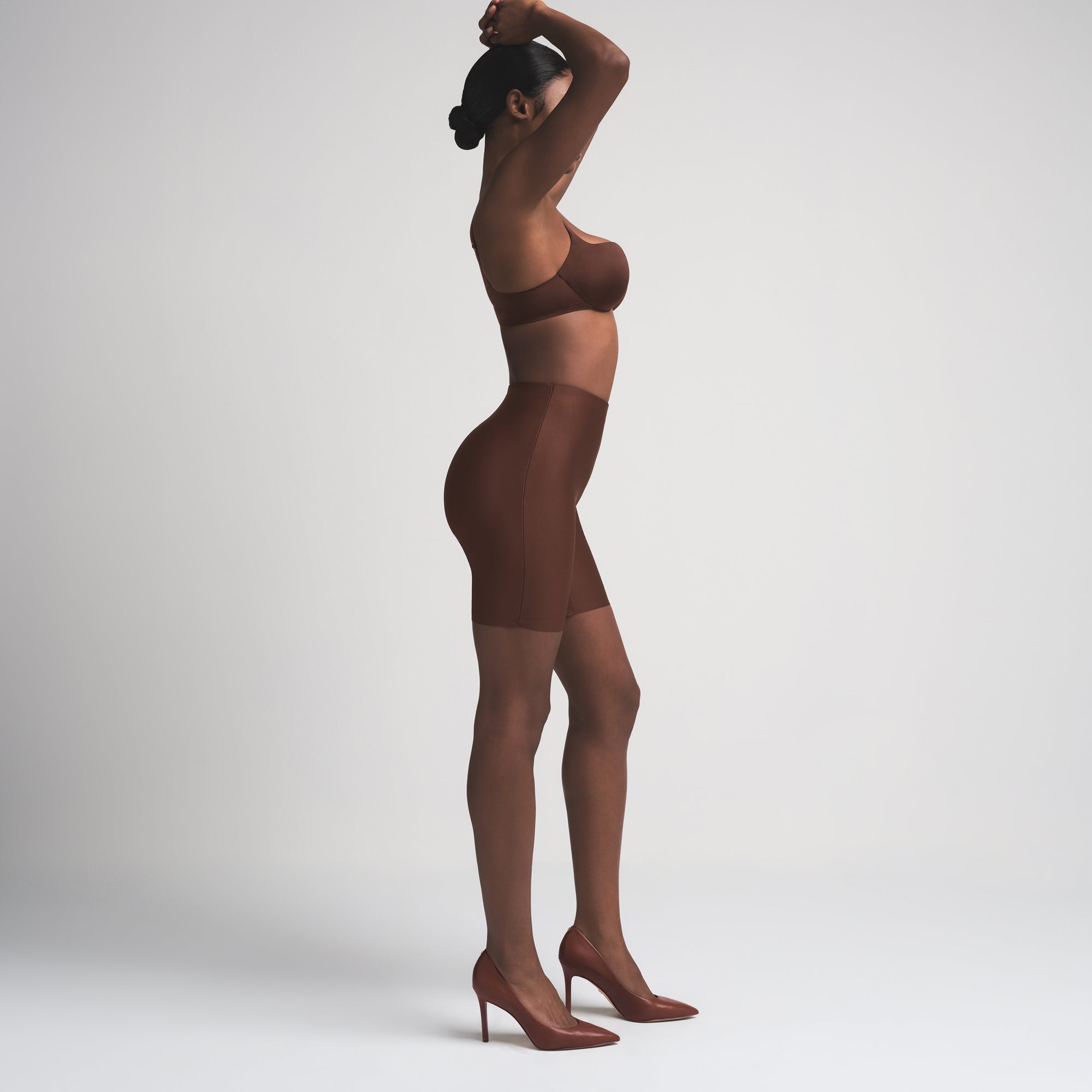 SKIMS BODY BUTT ENHANCING PADDED SHORT | COCOA ON A MODEL FRONT VIEW | FOCUS: 0.0, 1.0, 0.9