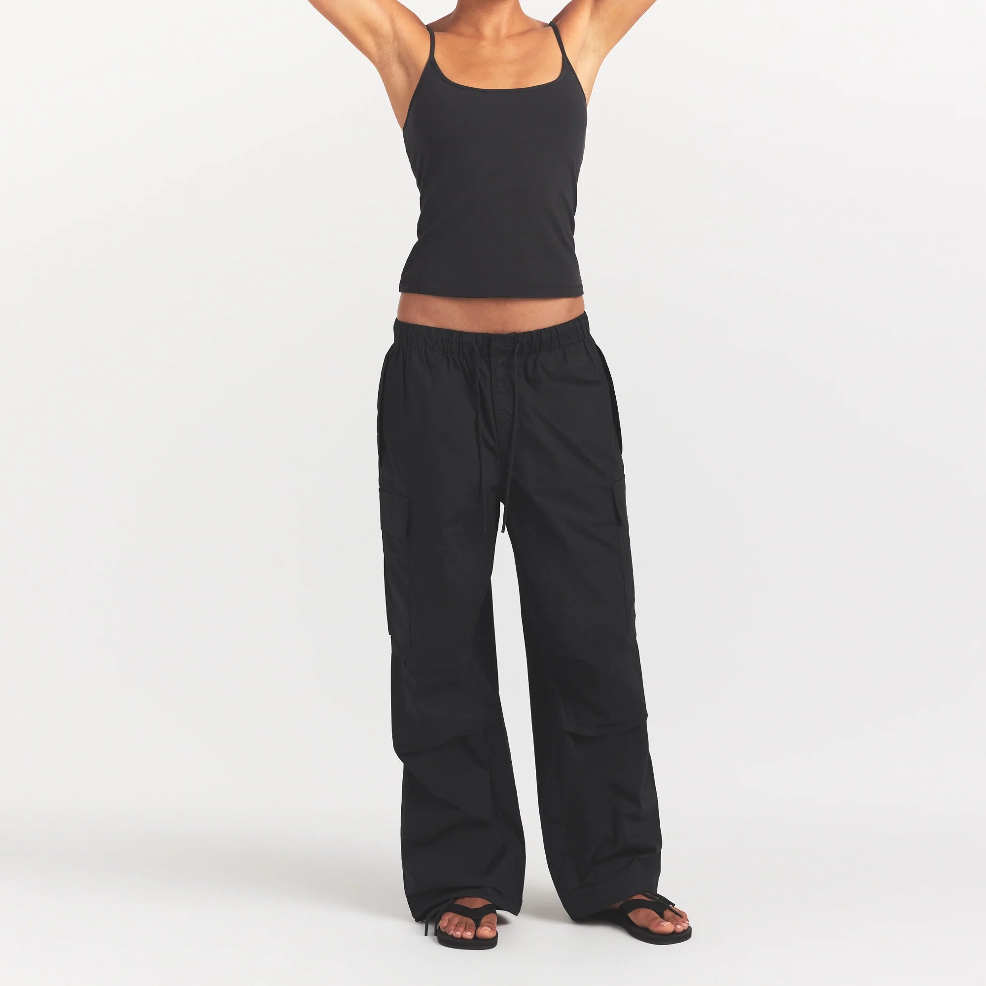 WOVEN COTTON OVERSIZED LOW RISE CARGO PANT | ONYX ON A MODEL SIDE VIEW @ | FOCUS: 0.0, 1.0, 0.9