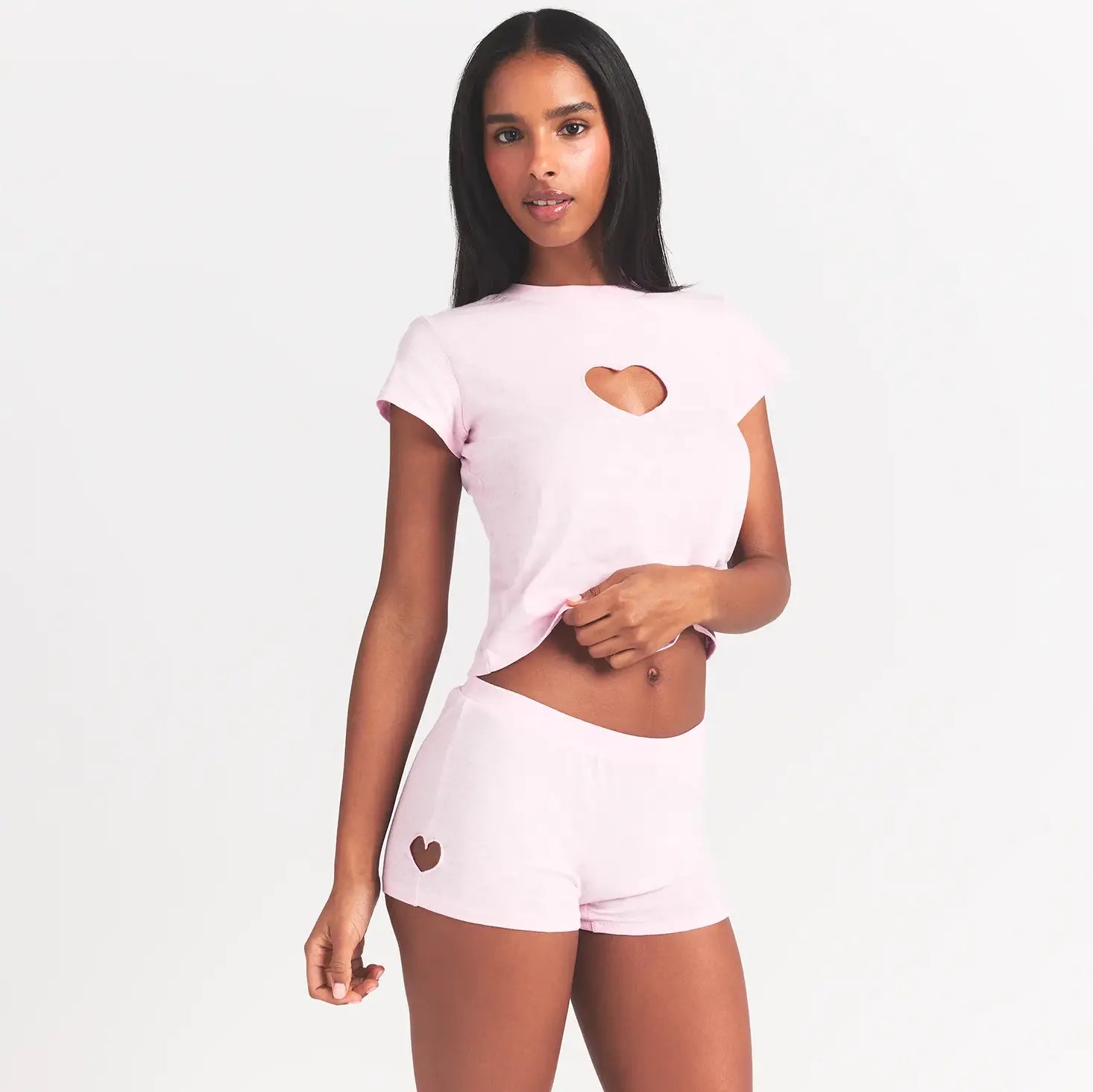 WORN IN JERSEY MICRO HEART SHORT | BABY PINK ON A MODEL FRONT VIEW @ | FOCUS: 0.0, 1.0, 0.9