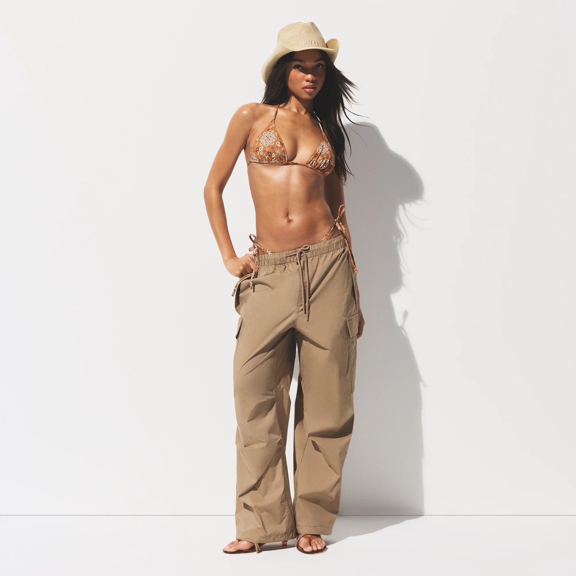 SIGNATURE SWIM TRIANGLE BIKINI TOP | ALMOND BANDANA ON A MODEL FRONT VIEW @ | FOCUS: 0.0, 1.0, 0.9