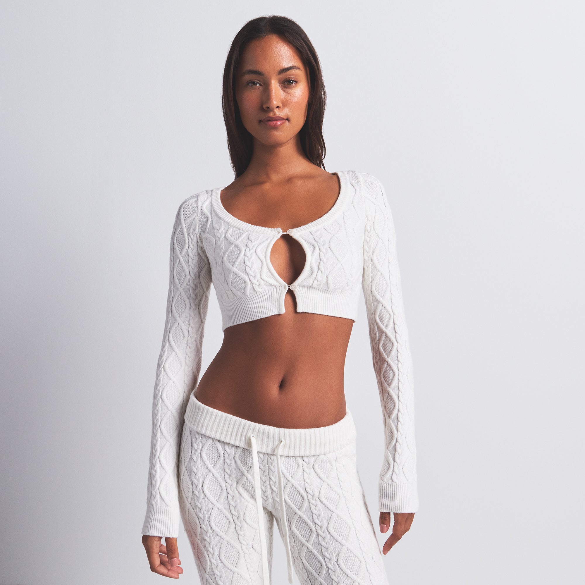 SWEATER KNIT CROPPED CARDIGAN | IVORY ON A MODEL FRONT VIEW @ | FOCUS: 0.0, 1.0, 0.9