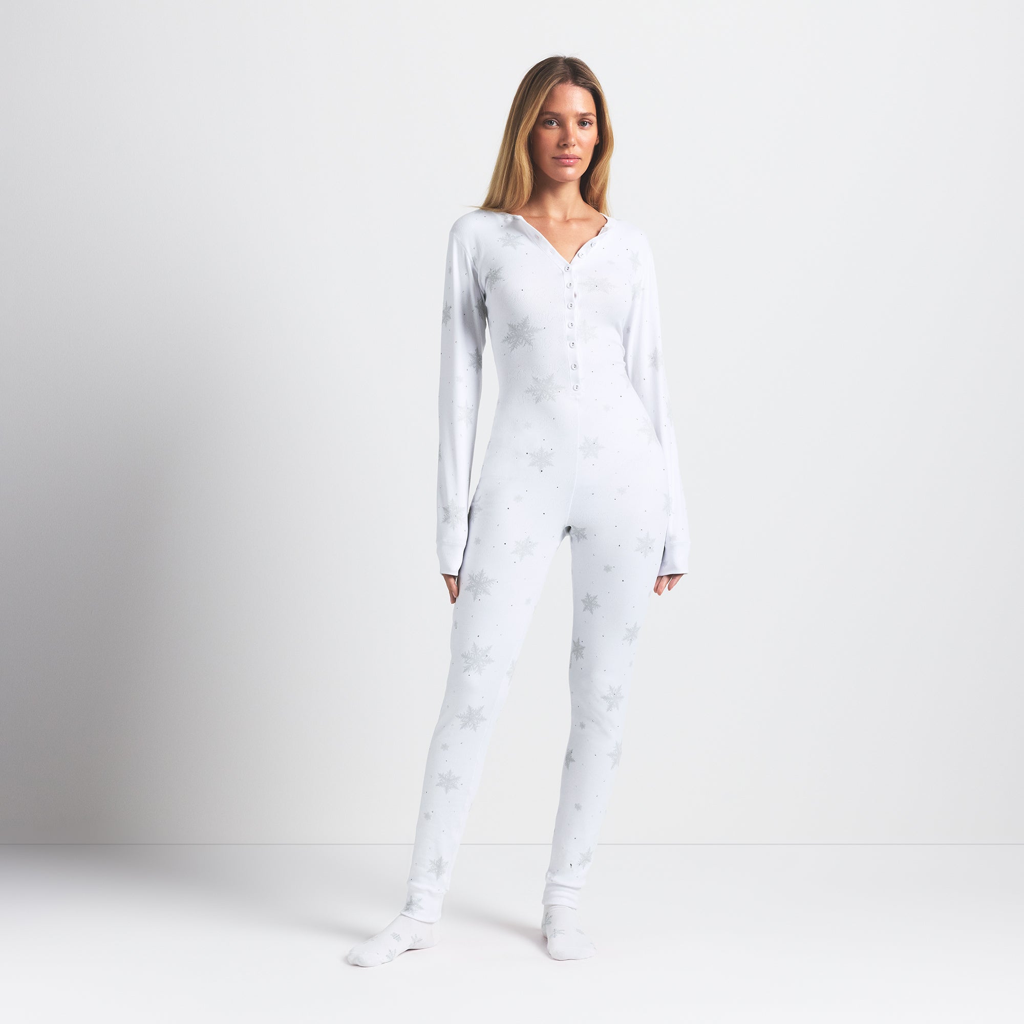 LOGO PLUSH POINTELLE RHINESTONE LONG ONESIE | SNOW RHINESTONE PRINT ON A MODEL FRONT VIEW @ | FOCUS: 0.0, 1.0, 0.9