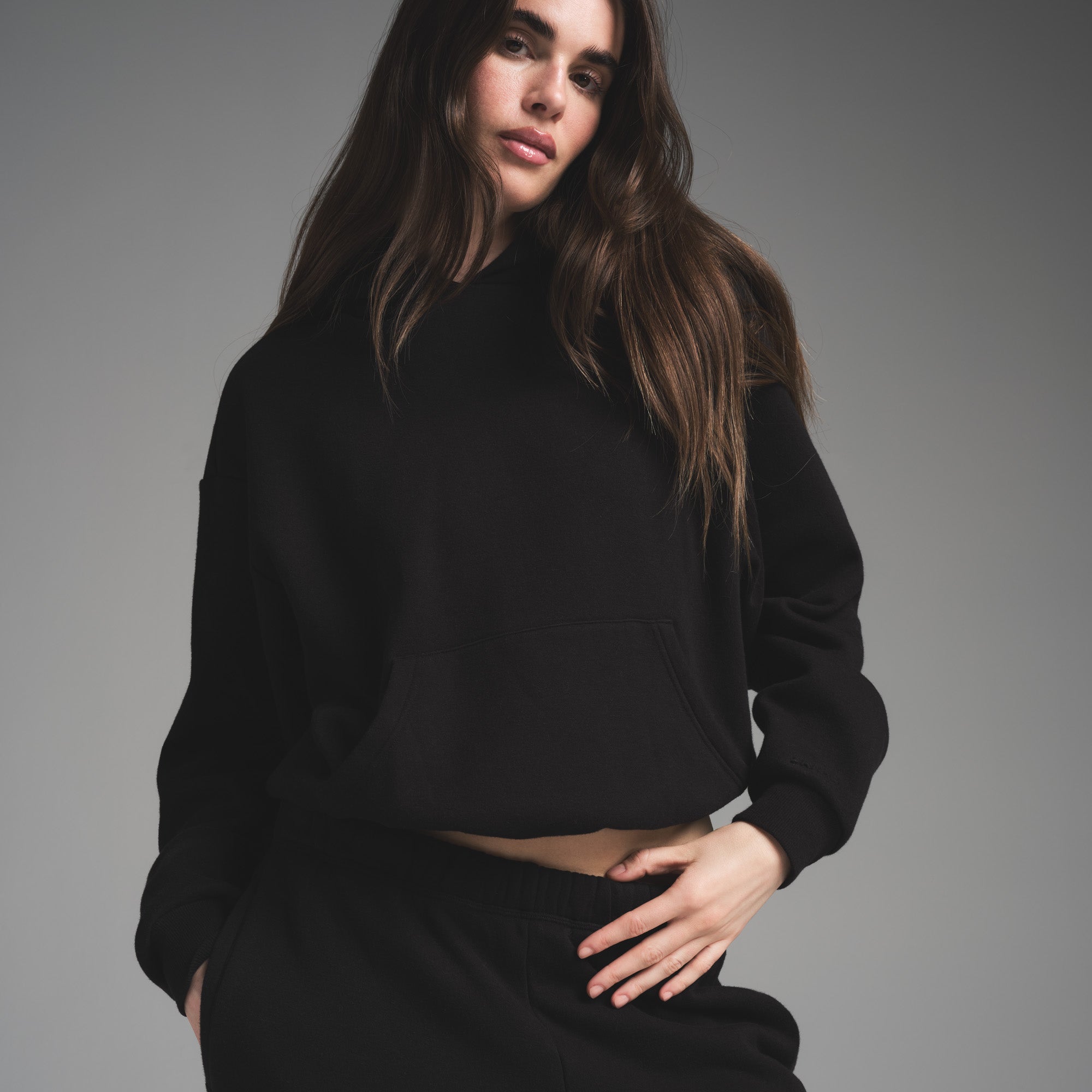 COTTON FLEECE CLASSIC HOODIE | ONYX ON A MODEL FRONT VIEW | FOCUS: 0.0, 1.0, 0.9