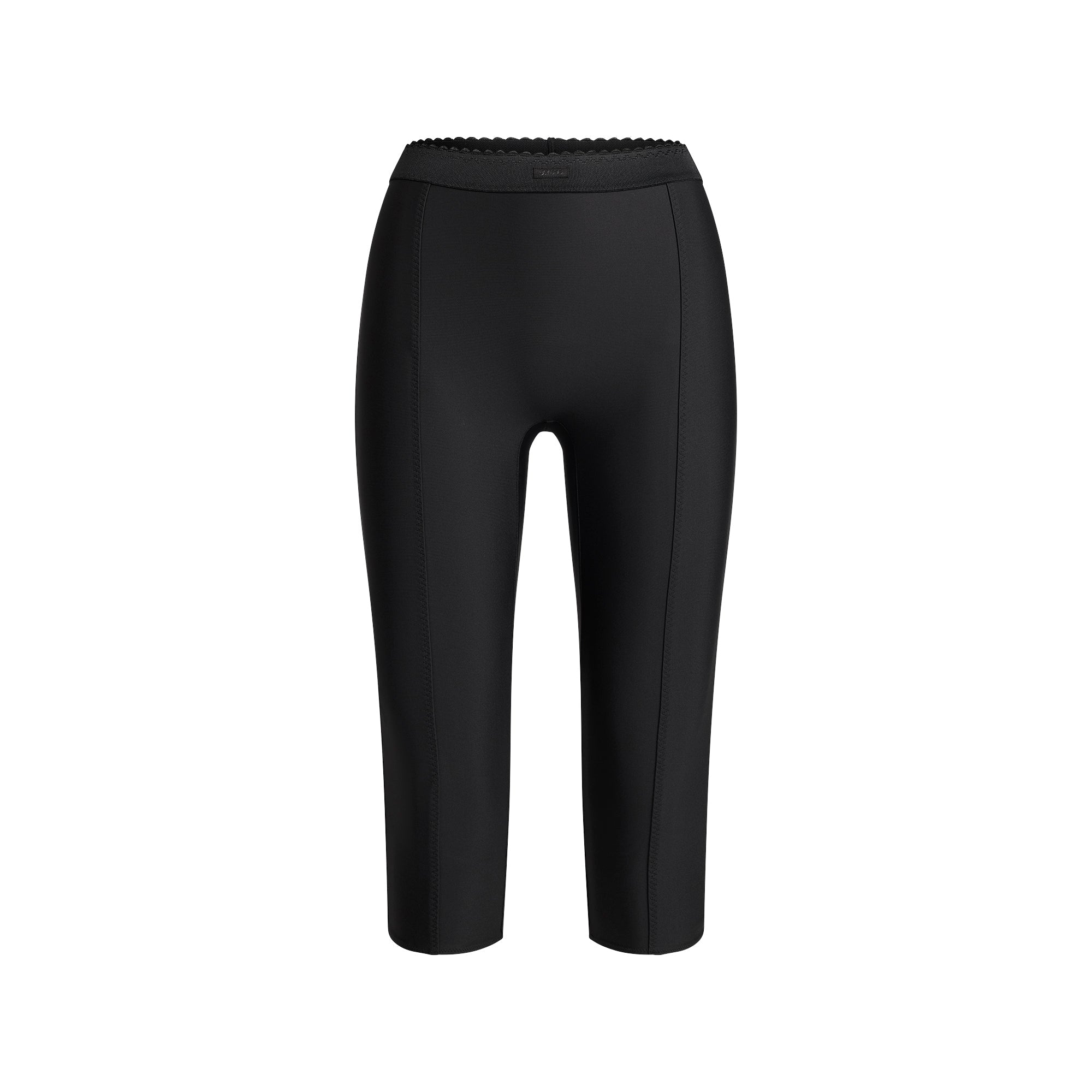 SKIMS BODY HIGH-WAISTED CAPRI | ONYX FLAT ON A WHITE BACKGROUND | FLT