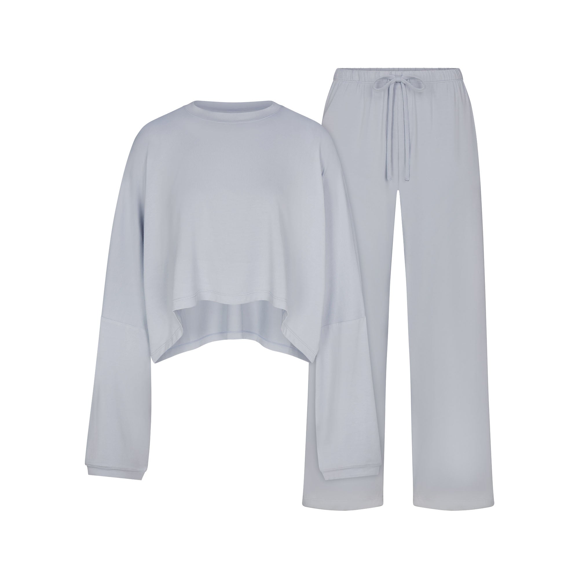 SKIMS SLEEP CROPPED LONG SLEEVE AND PANT SET | ZEN BLUE FLAT ON A WHITE BACKGROUND | FLT