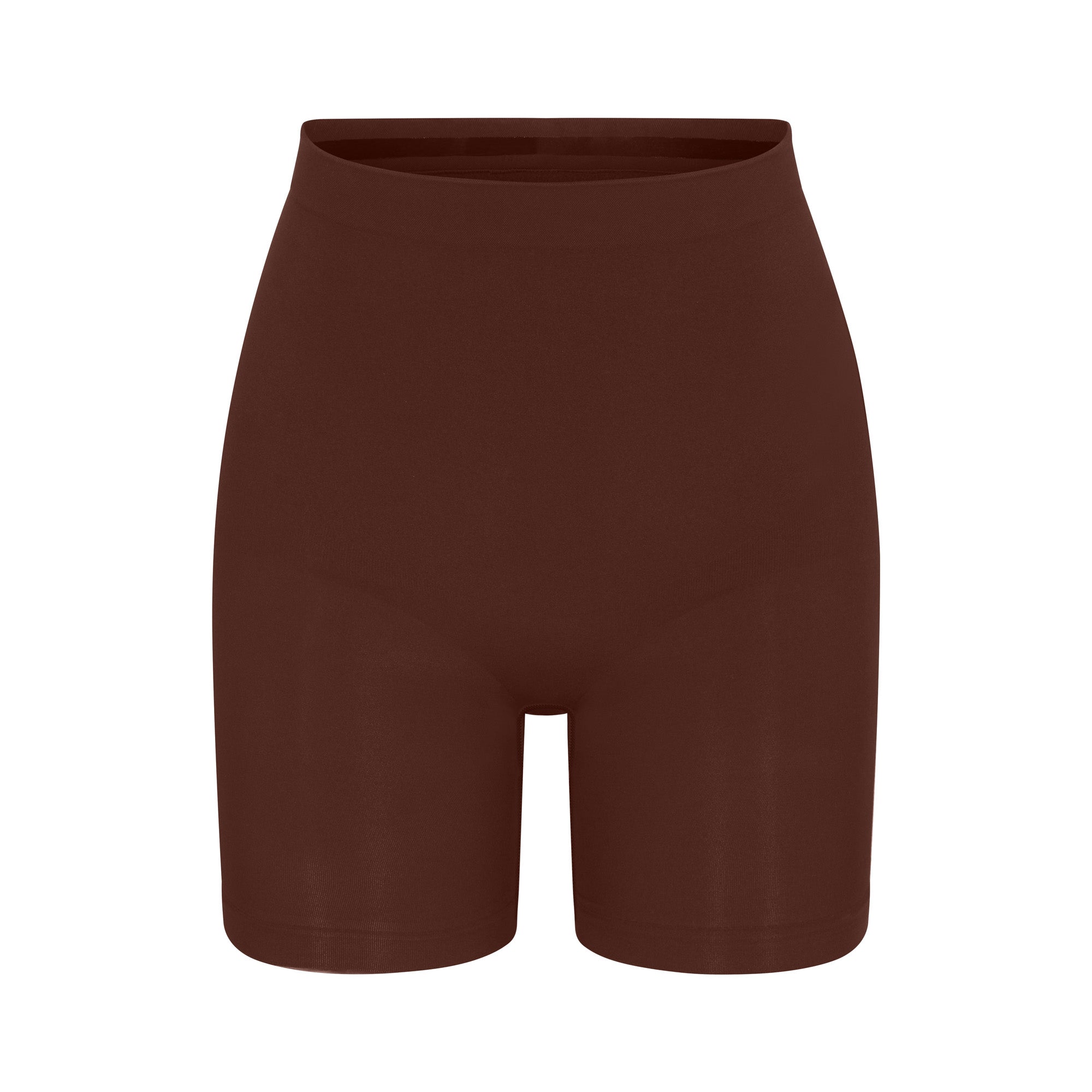 SEAMLESS SCULPT MID THIGH SHORT | COCOA (SHAPEWEAR SHORTS, SHAPEWEAR) LAYS FLAT ON A WHITE BACKGROUND | FLT