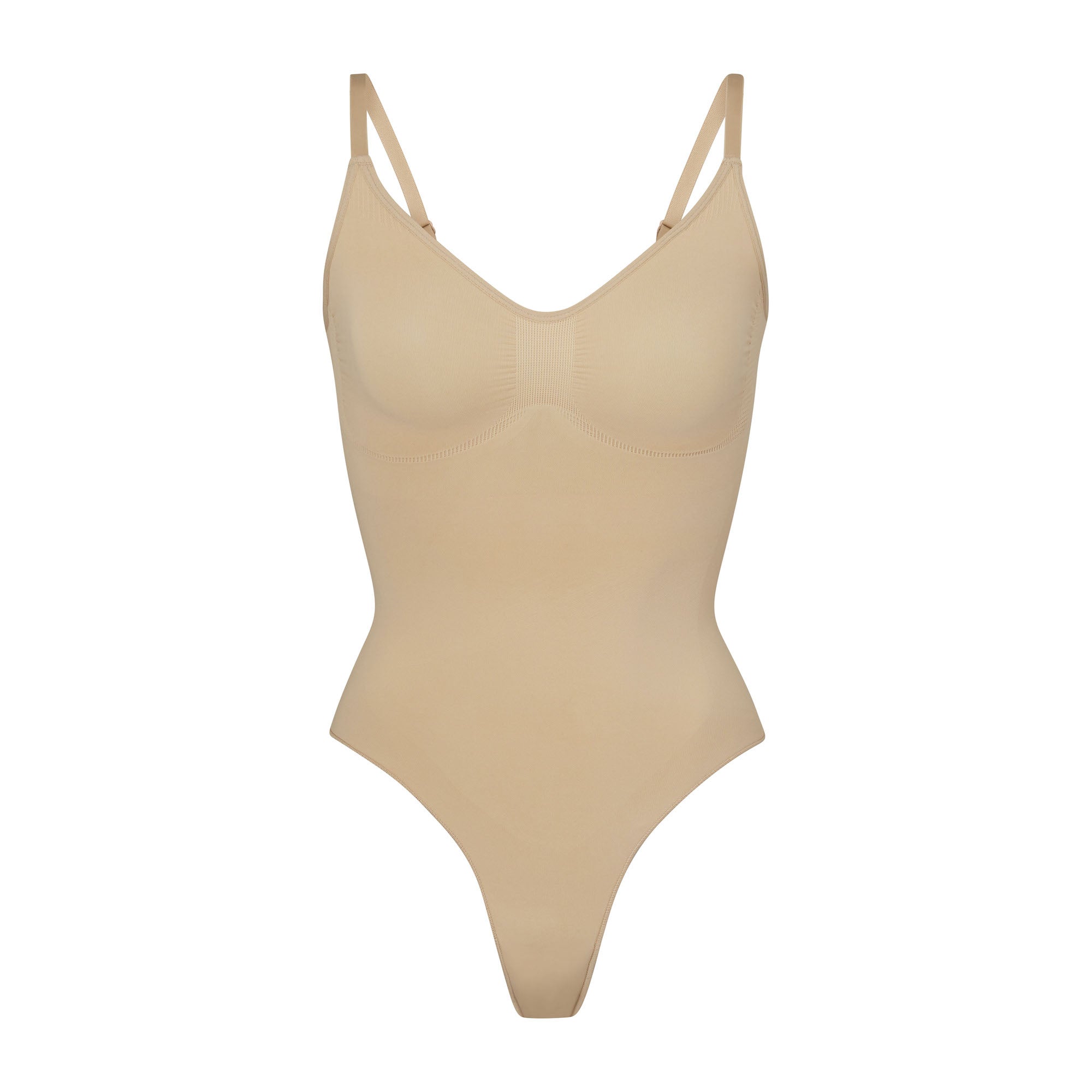 SEAMLESS SCULPT THONG BODYSUIT | CLAY (SHAPEWEAR BODYSUITS) LAYS FLAT ON A WHITE BACKGROUND | FLT