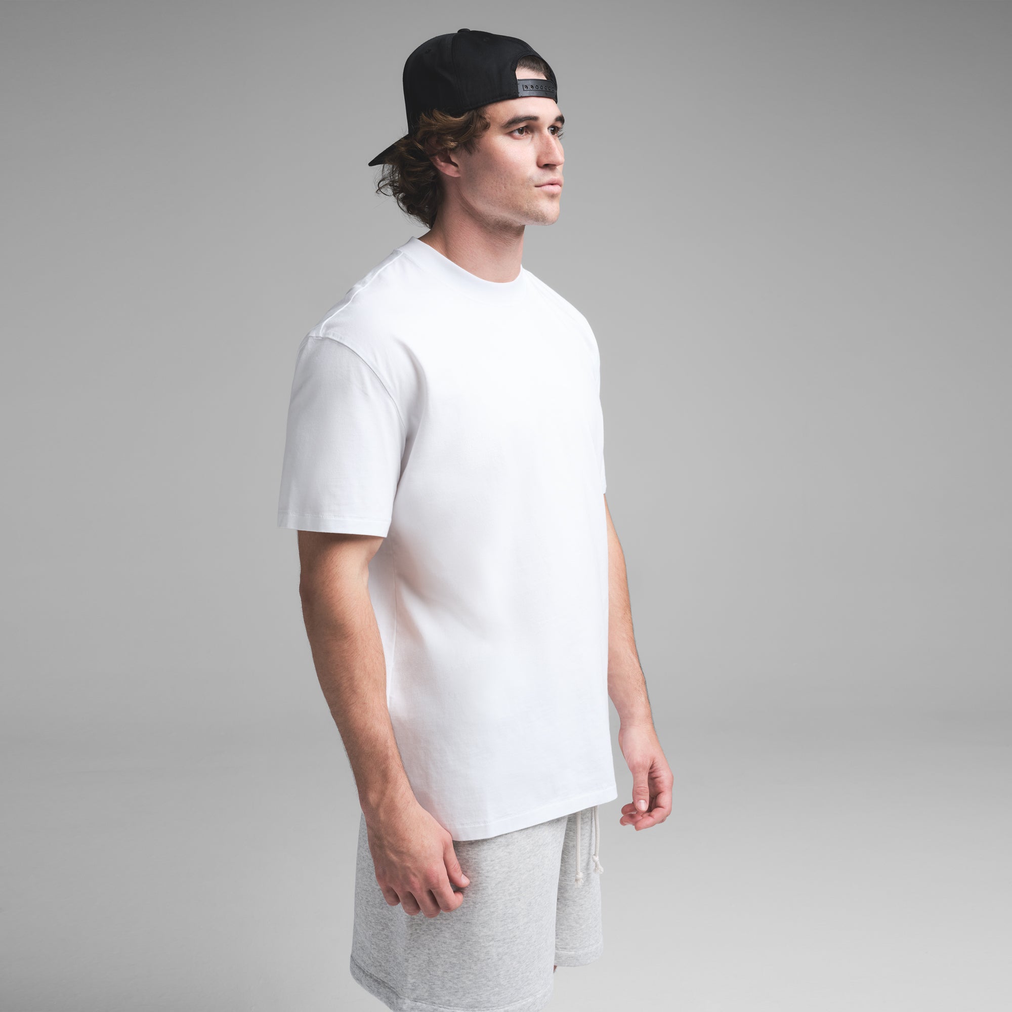 HEAVYWEIGHT COTTON MENS RELAXED T-SHIRT | CHALK ON A MODEL SIDE VIEW | FOCUS: 0.0, 1.0, 0.9