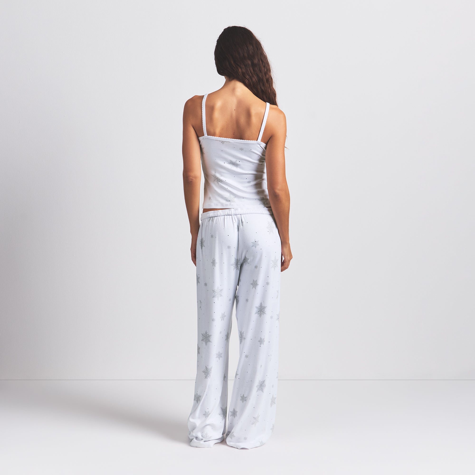 LOGO PLUSH POINTELLE RHINESTONE TANK | SNOW RHINESTONE PRINT ON A MODEL BACK VIEW @ | FOCUS: 0.0, 1.0, 0.9