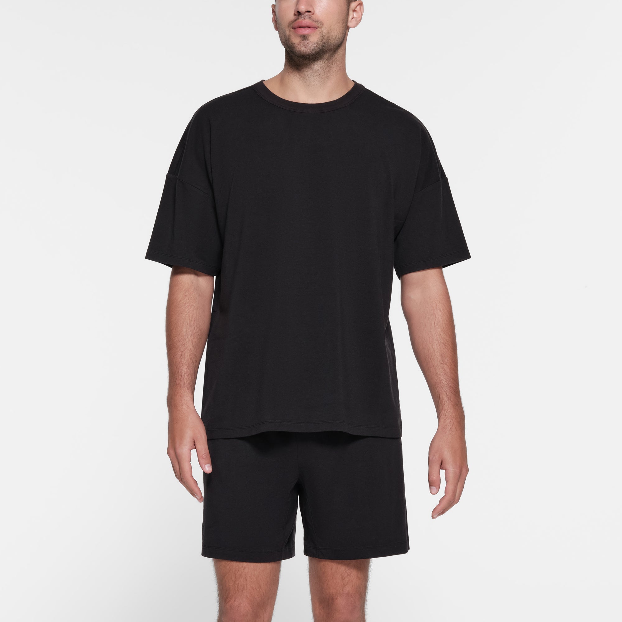 JERSEY LOUNGE MENS RELAXED T-SHIRT | OBSIDIAN ON A MODEL FRONT VIEW