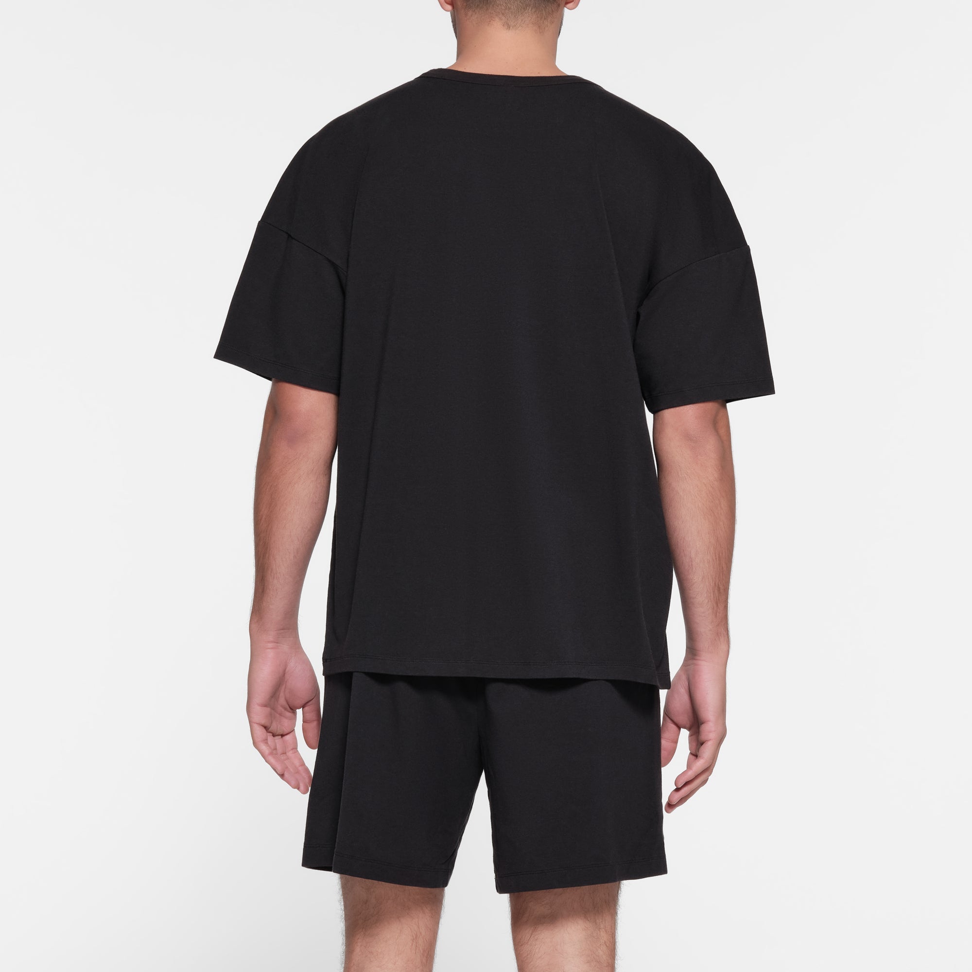 JERSEY LOUNGE MENS RELAXED T-SHIRT | OBSIDIAN ON A MODEL BACK VIEW