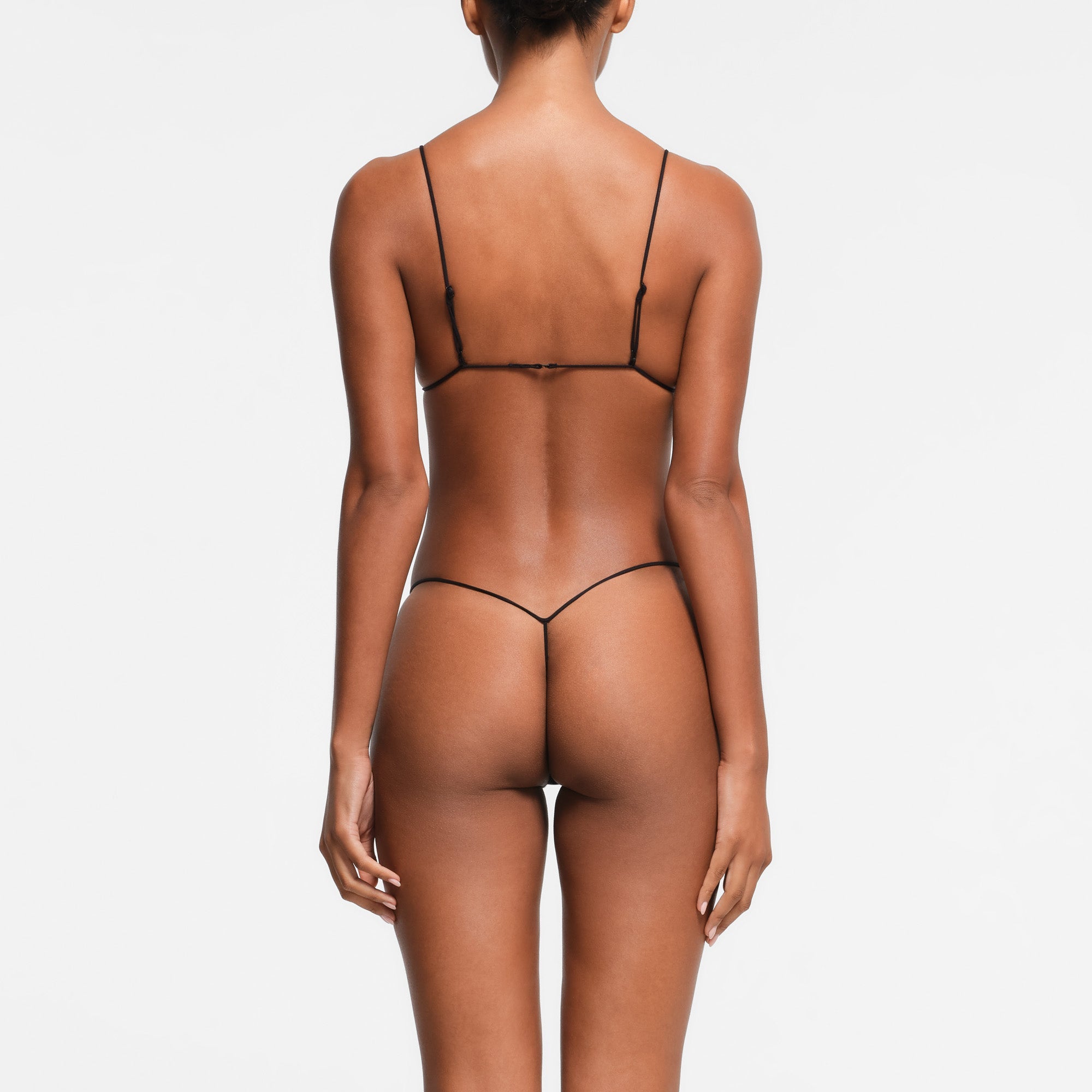 ULTRA FINE LACE MICRO TRIANGLE BRALETTE | ONYX ON A MODEL BACK VIEW