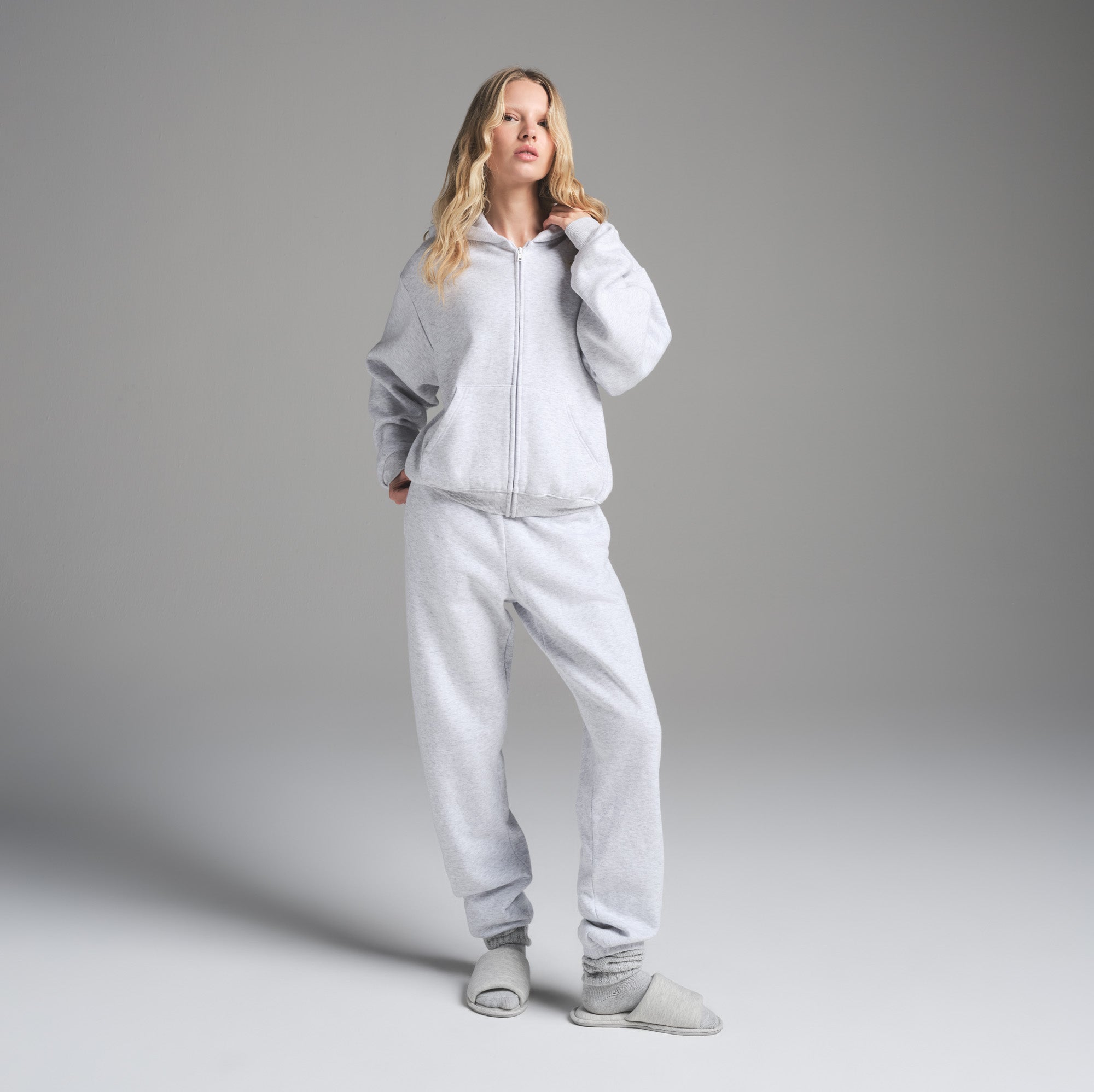 COTTON FLEECE CLASSIC ZIP UP HOODIE | LIGHT HEATHER GREY ON A MODEL FRONT VIEW | FOCUS: 0.0, 1.0, 0.9