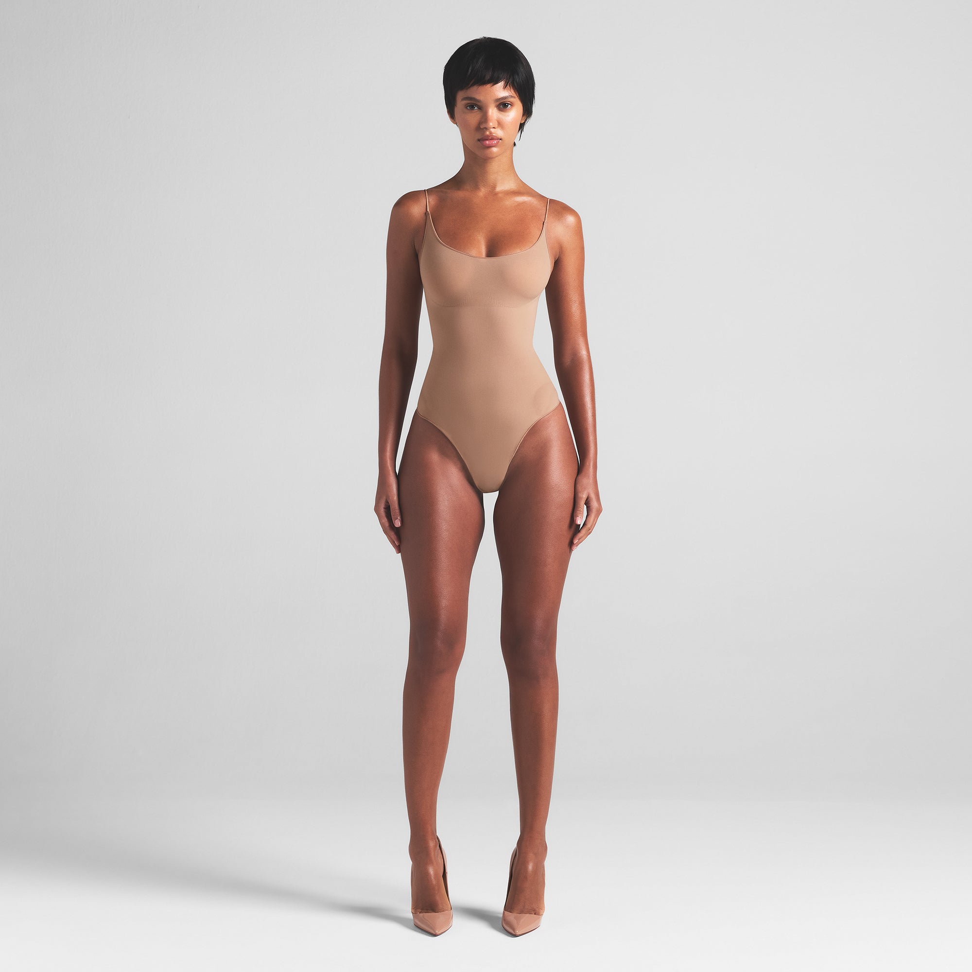 SHEER SEAMLESS THONG BODYSUIT | SIENNA ON A MODEL FRONT VIEW | FOCUS: 0.0, 1.0, 0.9