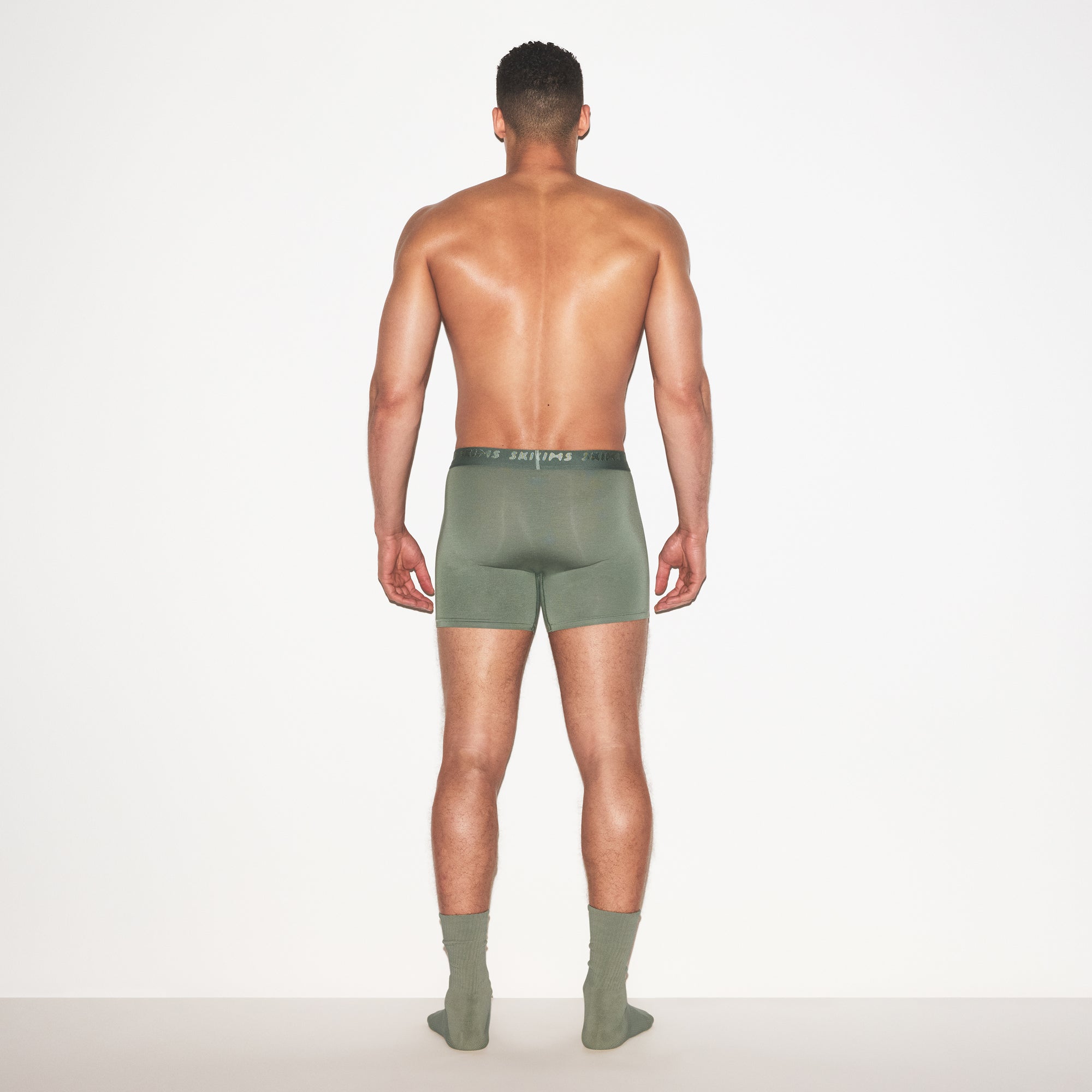 SKIMS STRETCH MENS 3" BOXER BRIEF 3-PACK | LAUREL MULTI ON A MODEL FRONT VIEW | FOCUS: 0.0, 1.0, 0.9