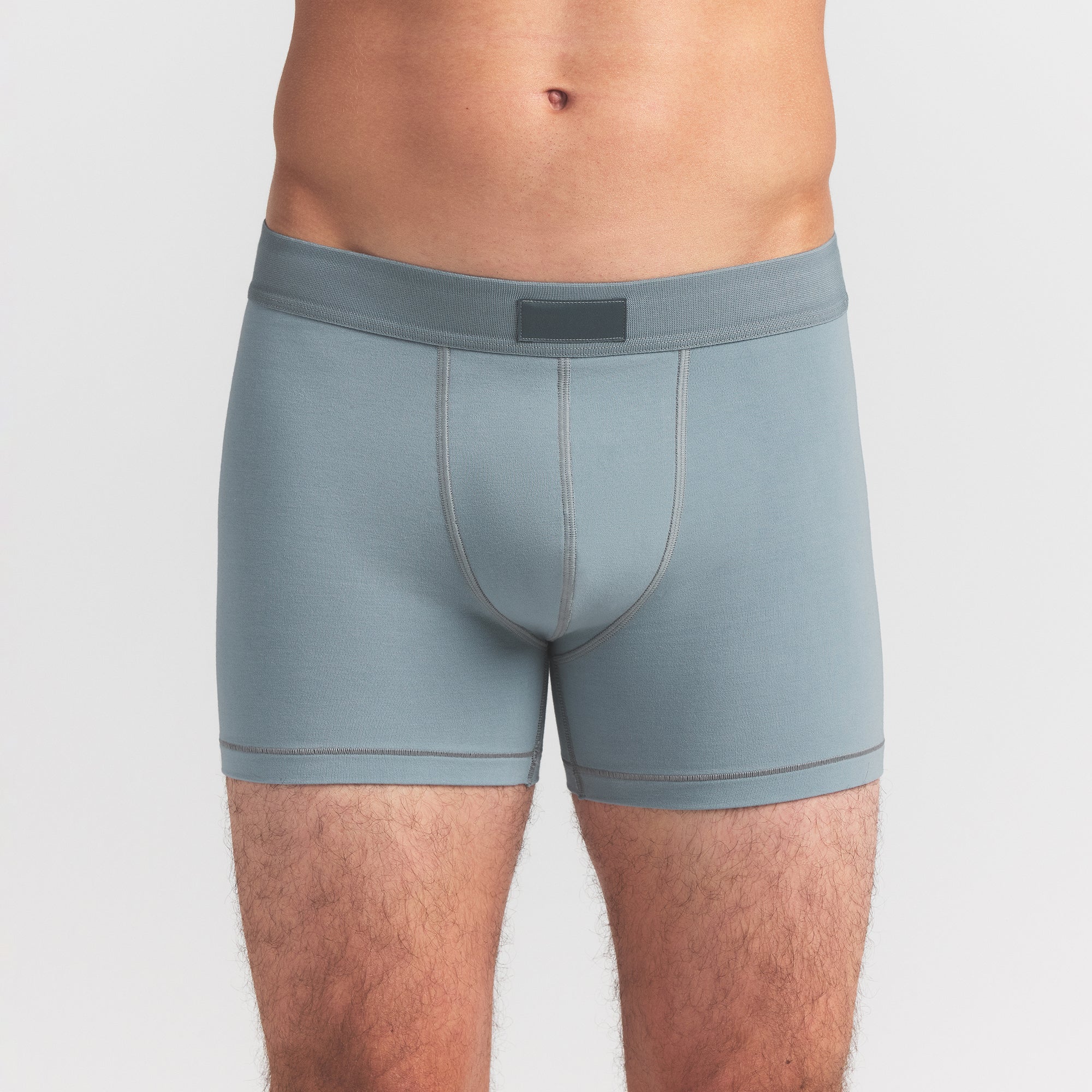 SKIMS COTTON MENS 3" BOXER BRIEF 3-PACK | VERDANT MULTI ON A MODEL FRONT VIEW @ | FOCUS: 0.0, 1.0, 0.9