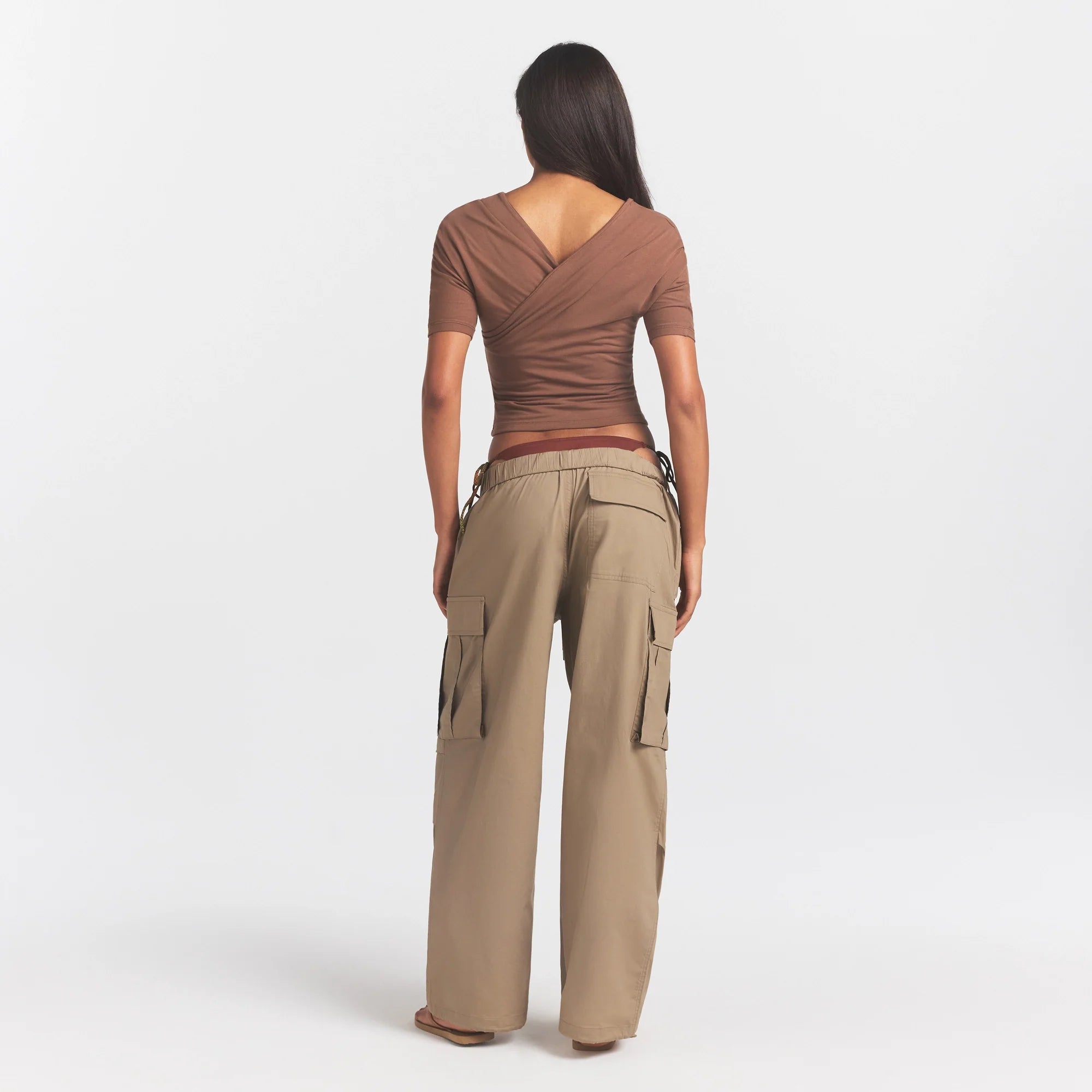 WOVEN COTTON OVERSIZED LOW RISE CARGO PANT | DESERT ON A MODEL FRONT VIEW @ | FOCUS: 0.0, 1.0, 0.9