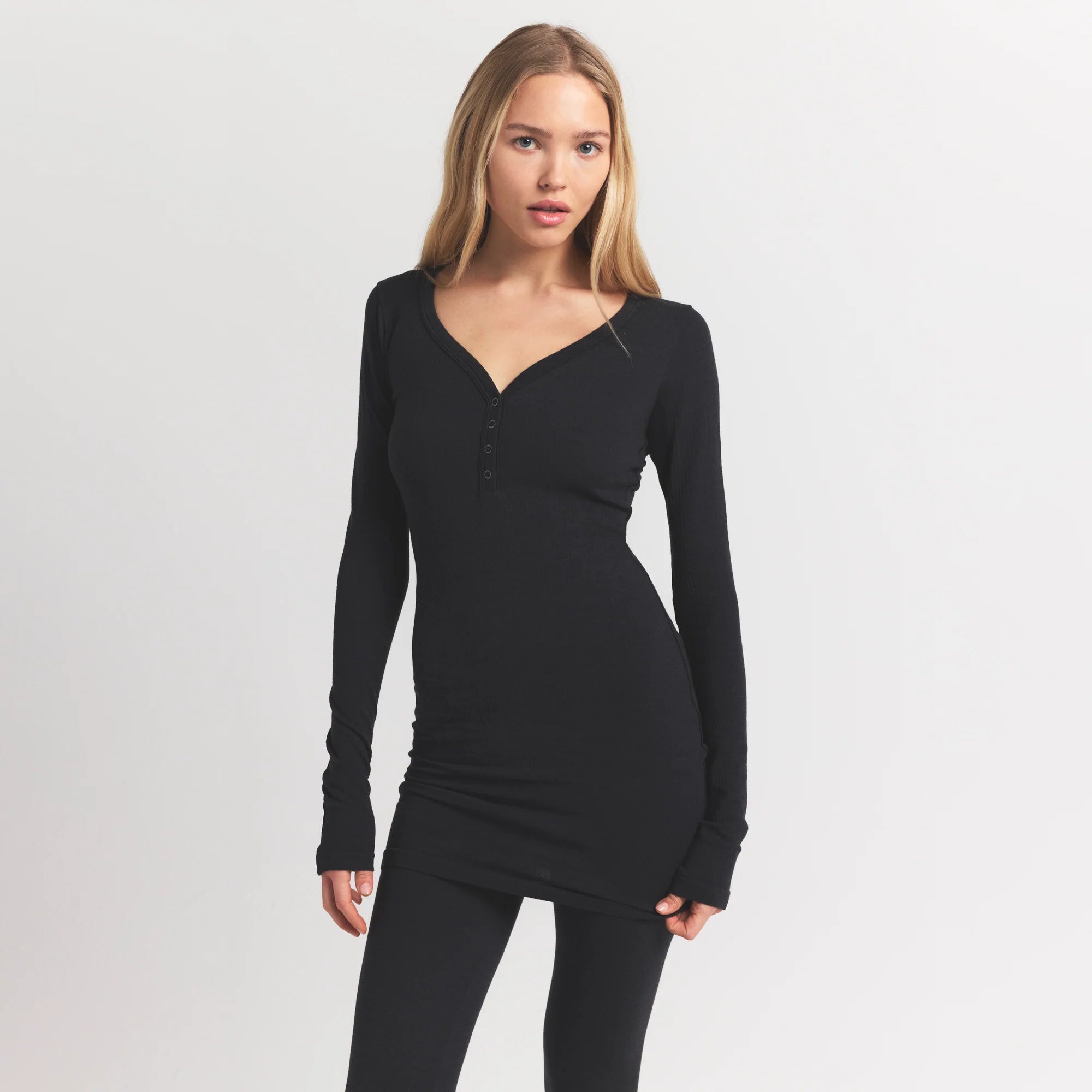 WOOL RIB HENLEY DRESS | OBSIDIAN ON A MODEL FRONT VIEW @ | FOCUS: 0.9, 0.1, 0.7