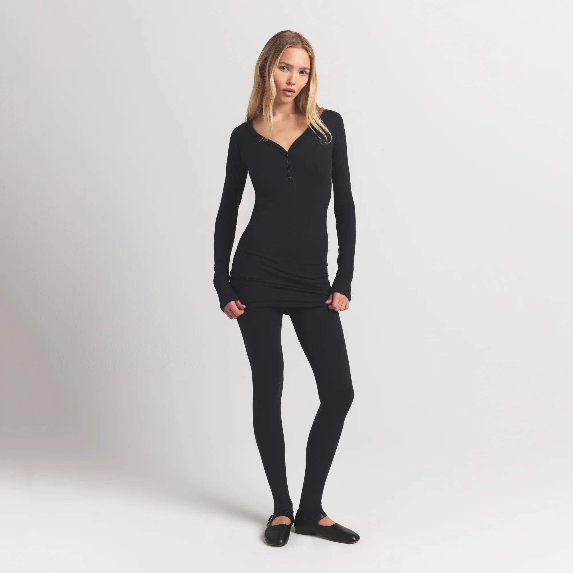 WOOL RIB HENLEY DRESS | OBSIDIAN ON A MODEL FRONT VIEW @ | FOCUS: 0.9, 0.1, 0.7