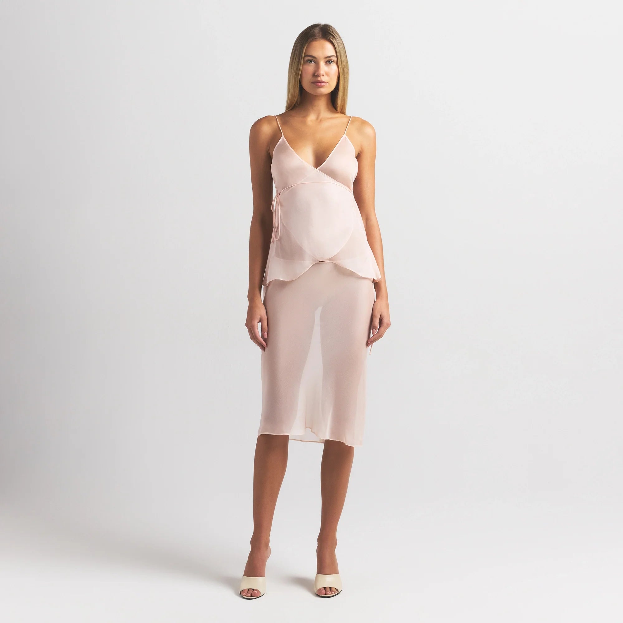 SKIMS ROMANCE WRAP CAMI TOP | PRIMROSE ON A MODEL FRONT VIEW @ | FOCUS: 0.0, 1.0, 0.9