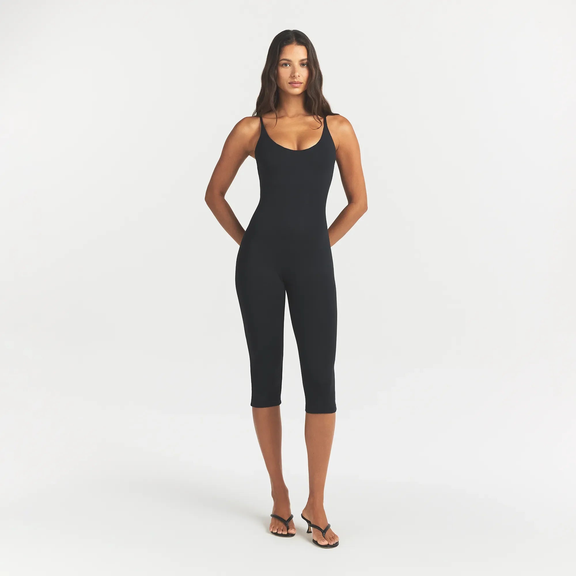 SMOOTH LAYERS CAPRI CATSUIT | OBSIDIAN ON A MODEL FRONT VIEW @ | FOCUS: 0.0, 1.0, 0.9