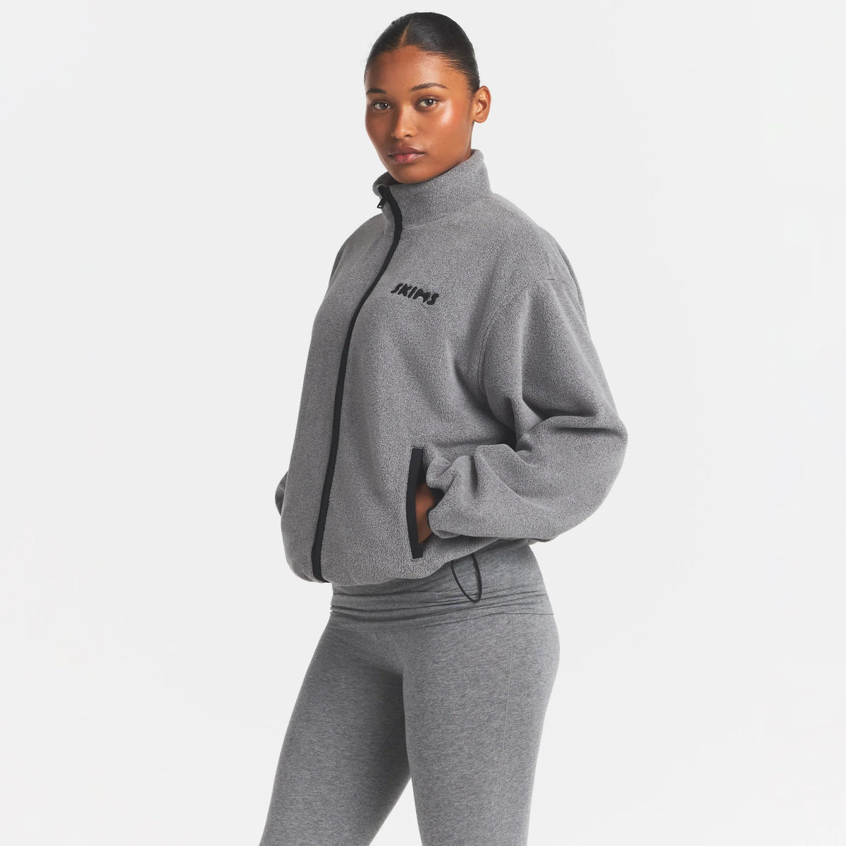OUTDOOR FLEECE MOCK NECK ZIP UP JACKET | DARK HEATHER GREY ON A MODEL SIDE VIEW @ | FOCUS: 0.0, 1.0, 0.9