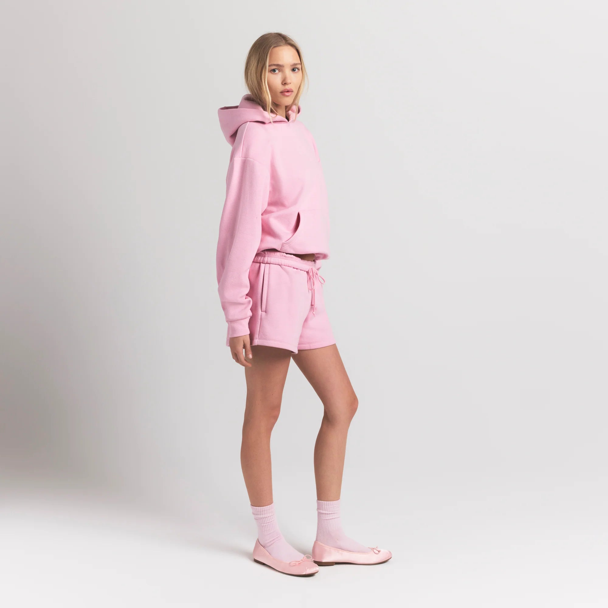 COTTON FLEECE CLASSIC HOODIE | HALITE ON A MODEL SIDE VIEW @ | FOCUS: 0.9, 0.1, 0.7