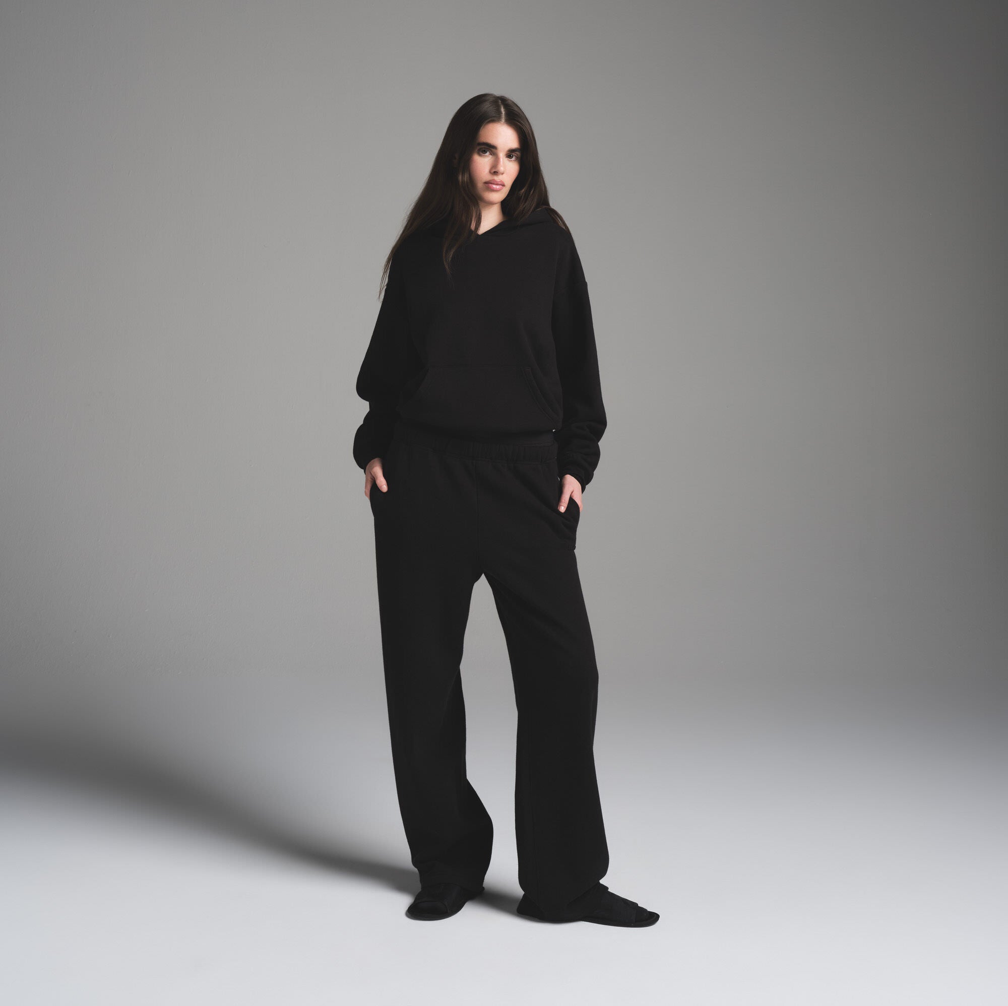 COTTON FLEECE CLASSIC HOODIE | ONYX ON A MODEL FRONT VIEW | FOCUS: 0.0, 1.0, 0.9