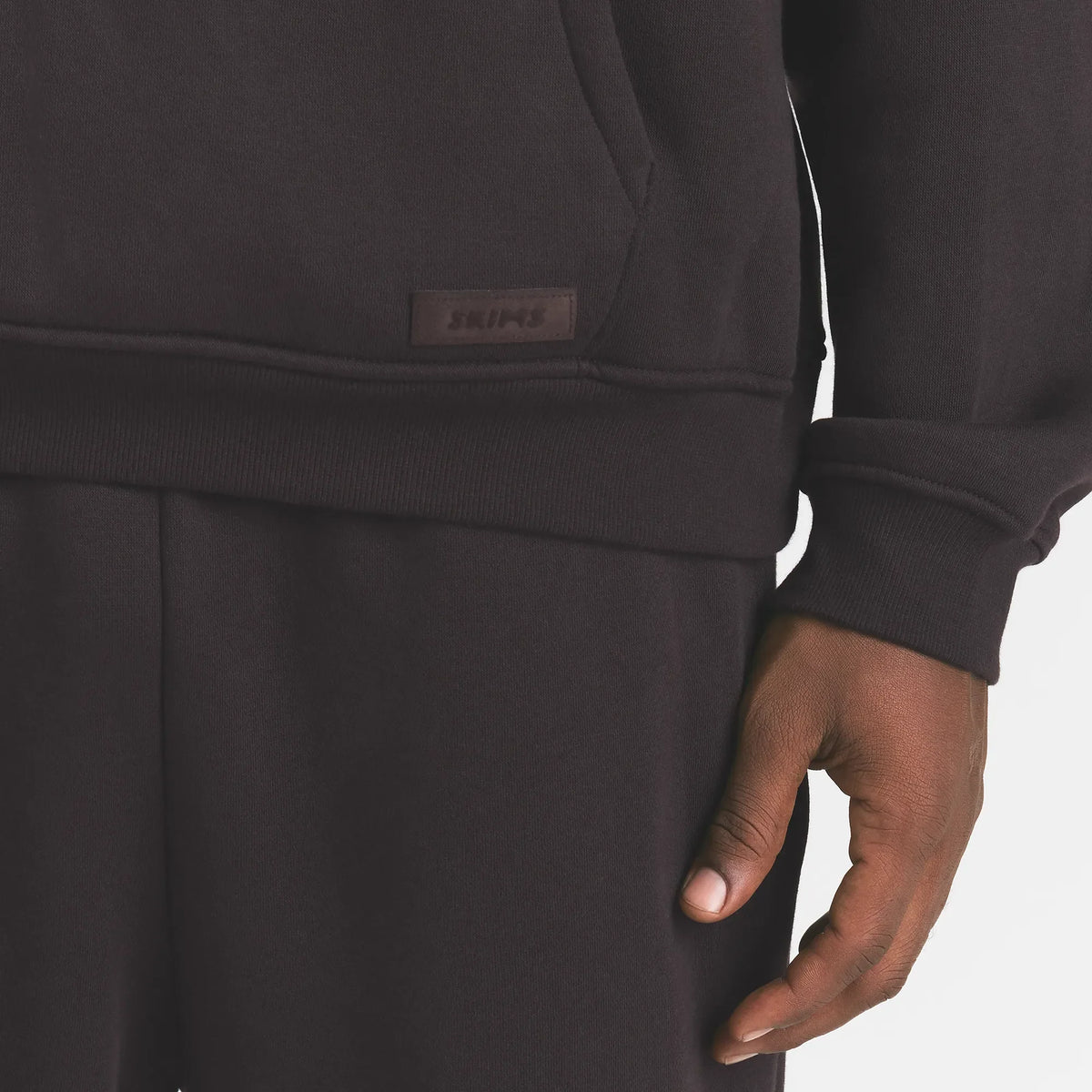 FLEECE LOUNGE MENS RELAXED HOODIE | DARK ROAST ON A MODEL FRONT VIEW @ | FOCUS: 0.0, 1.0, 0.9