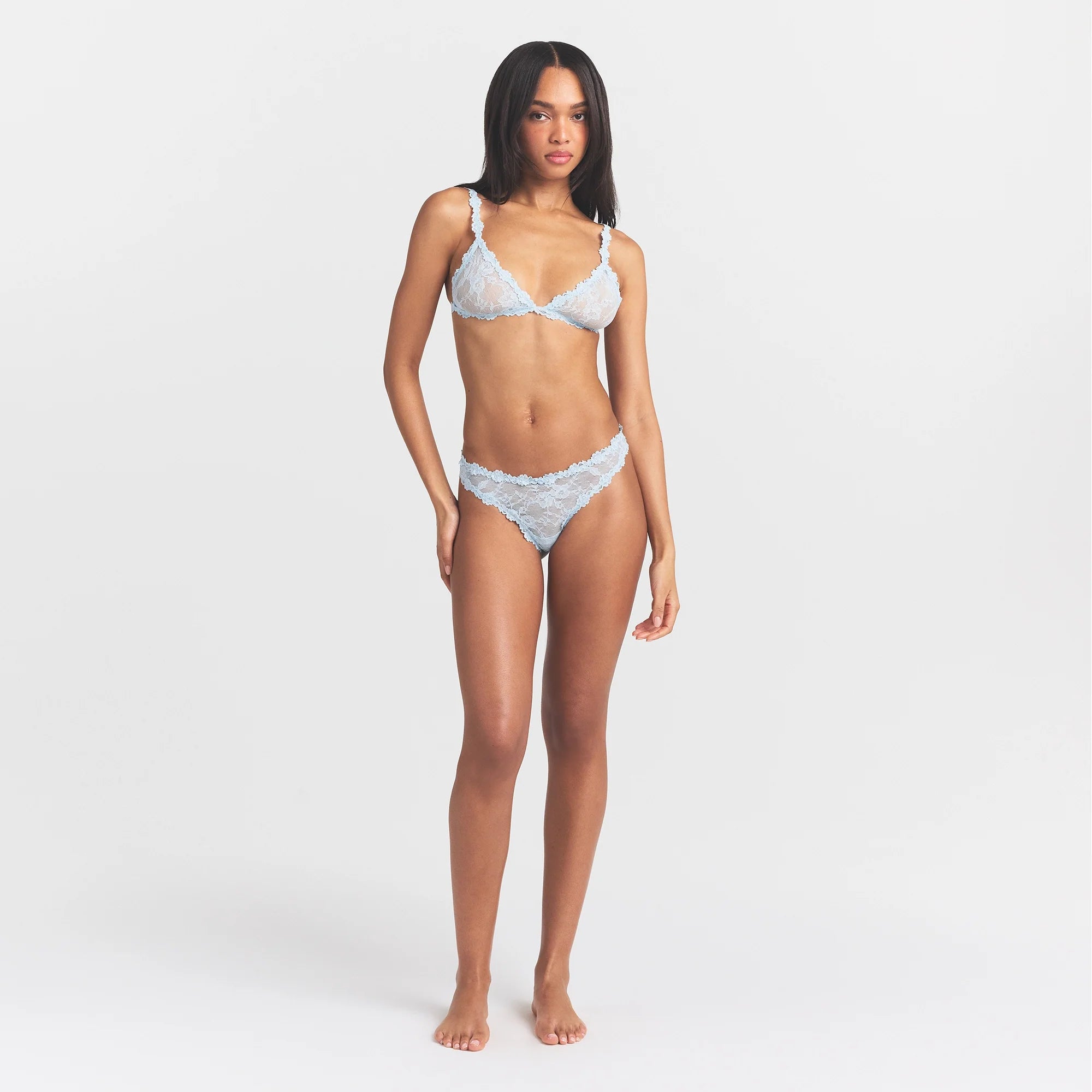 STRETCH LACE DIPPED THONG | POWDER BLUE ON A MODEL FRONT VIEW @ | FOCUS: 0.0, 1.0, 0.9