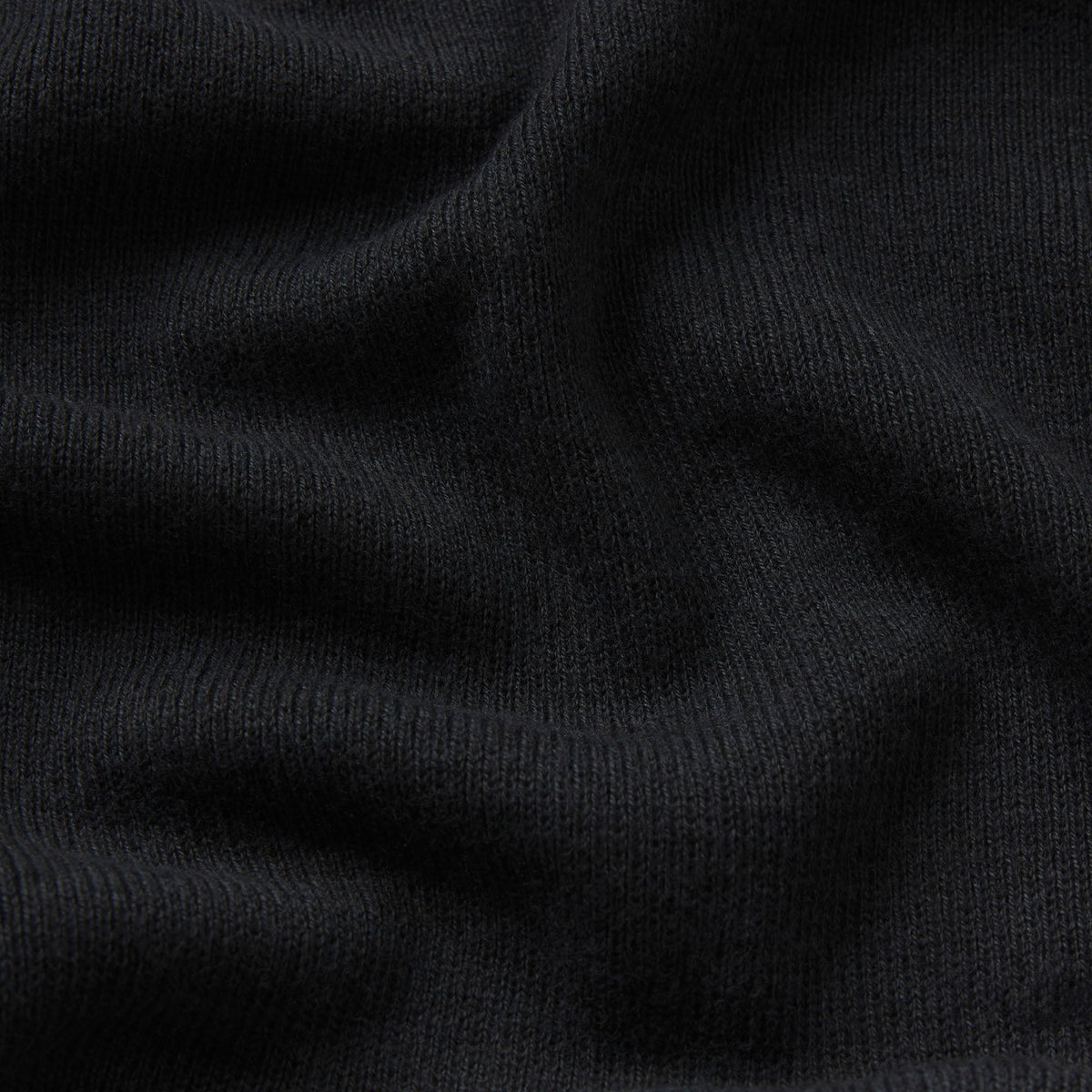 ESSENTIAL SWEATERS ROUNDED CROPPED CARDIGAN | ONYX & LAYS FLAT ON A WHITE BACKGROUND | FLT