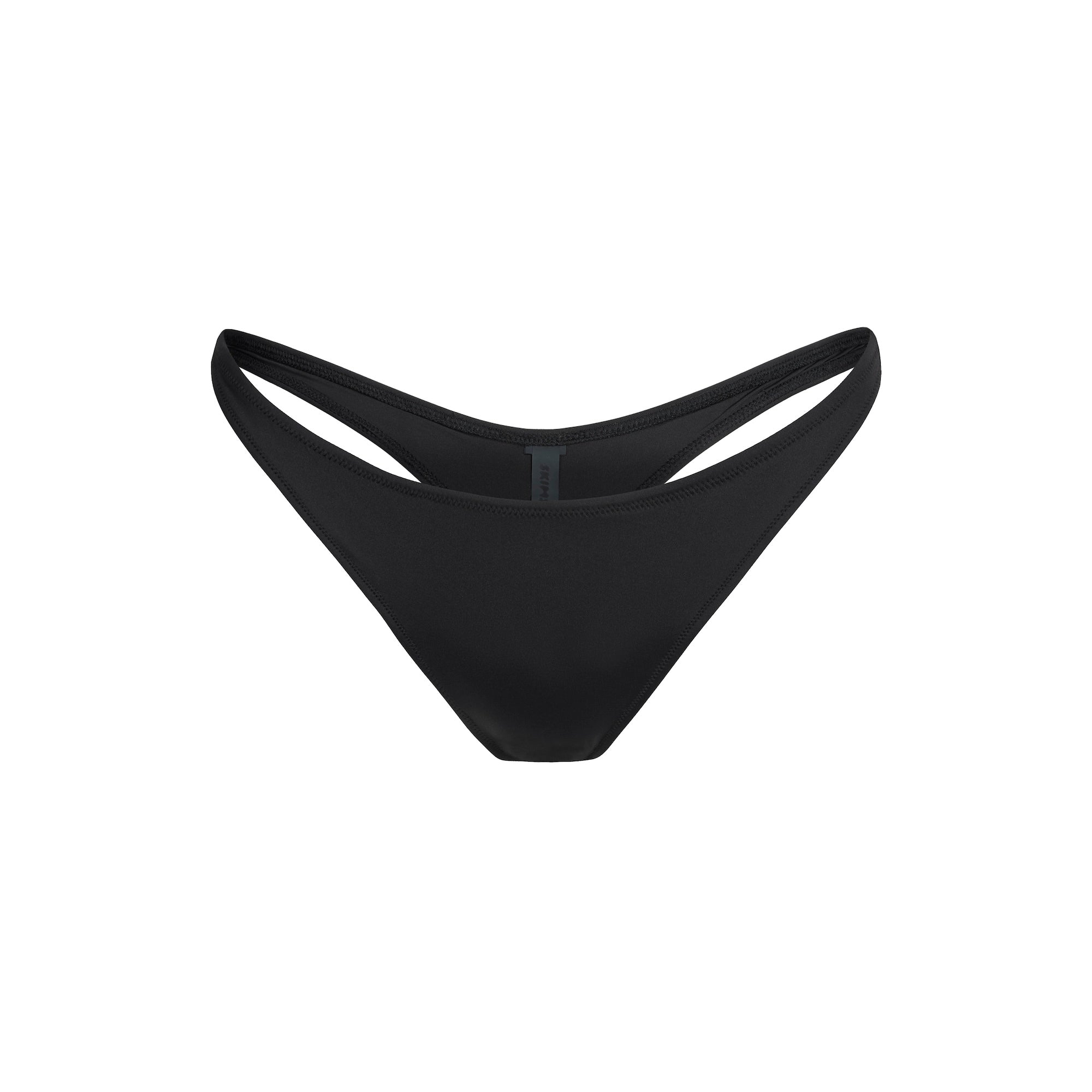 SIGNATURE SWIM THONG BIKINI BOTTOM | ONYX FLAT ON A WHITE BACKGROUND | FLT