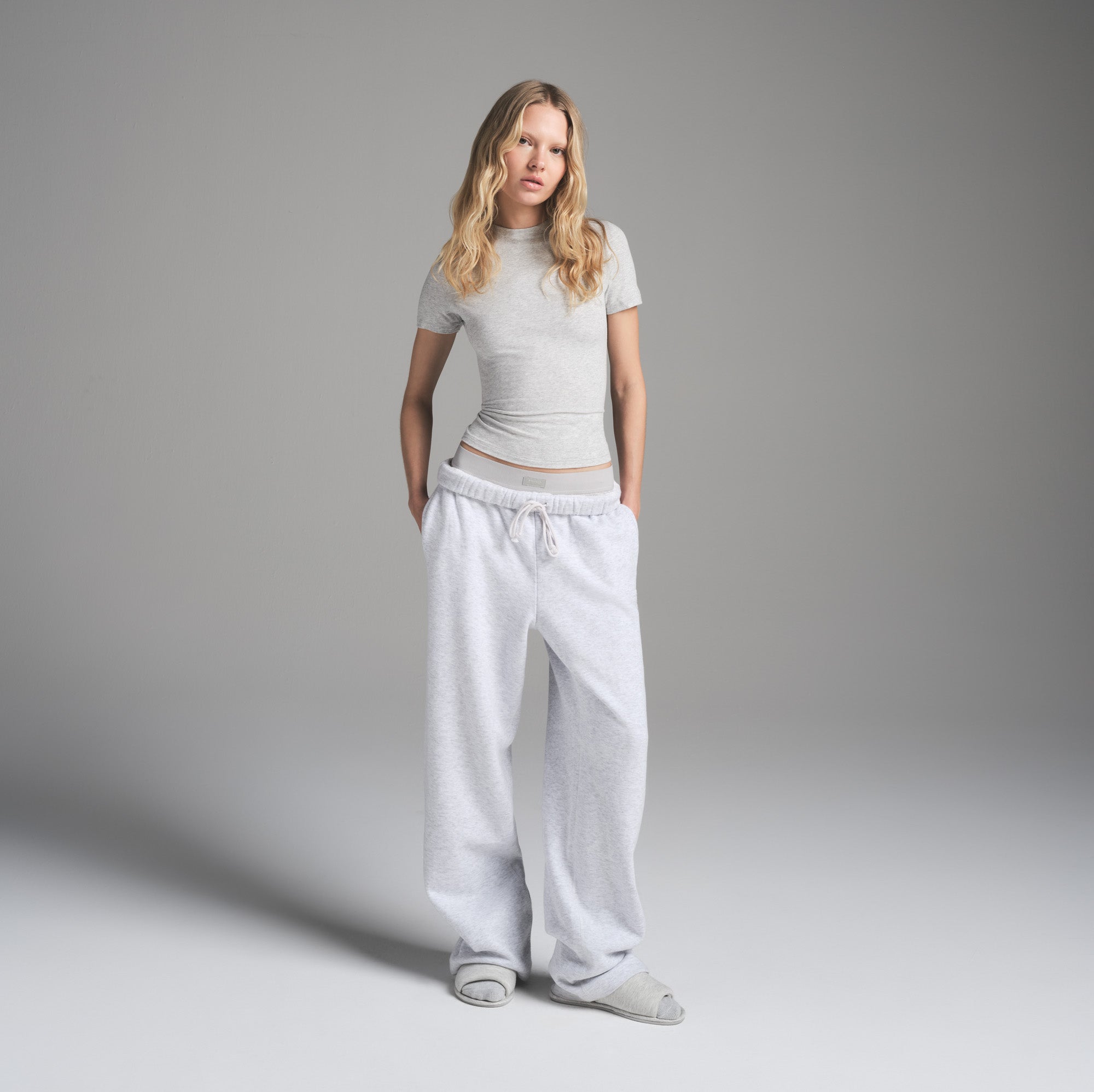 COTTON FLEECE CLASSIC STRAIGHT LEG PANT | LIGHT HEATHER GREY ON A MODEL FRONT VIEW | FOCUS: 0.0, 1.0, 0.9
