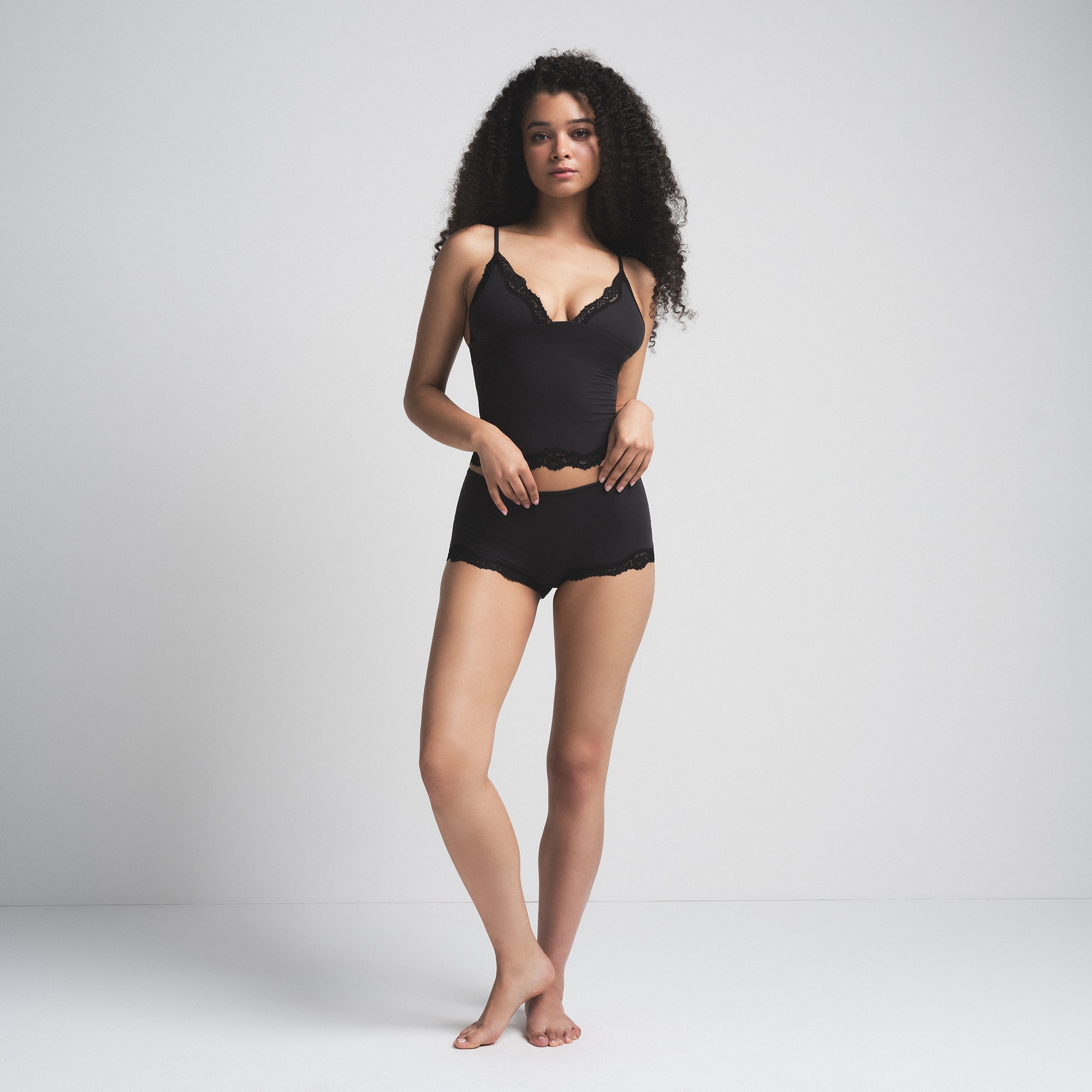 FITS EVERYBODY LACE TRIANGLE CAMI AND BOY SHORT SET | ONYX (BOY SHORTS) ON A MODEL FRONT VIEW | FOCUS: 0.0, 1.0, 0.9