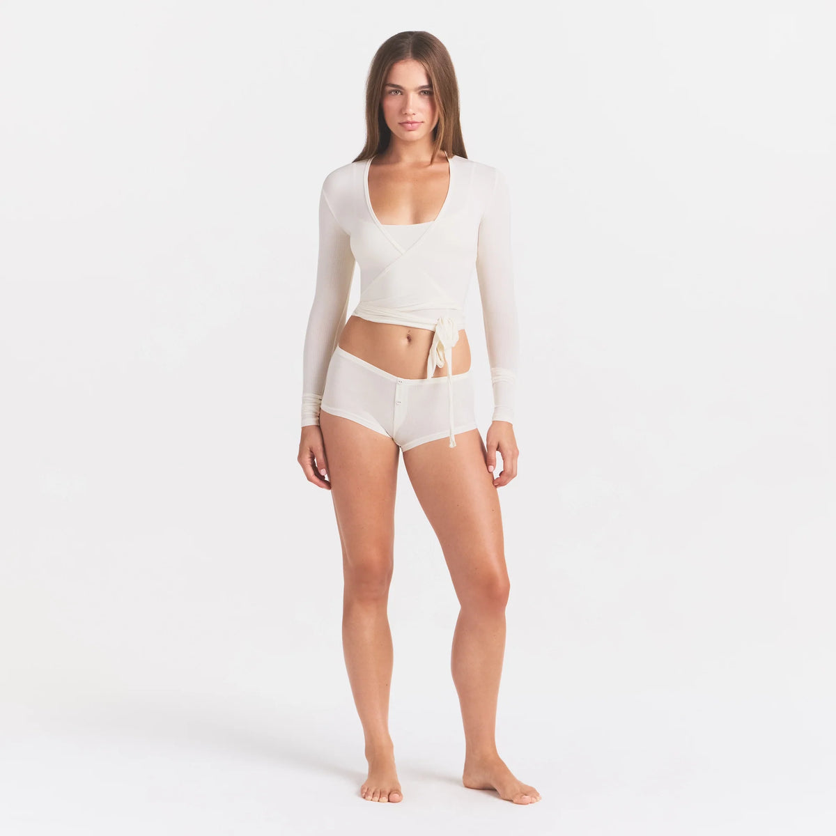 CLOUD SLEEP WRAP TOP | ECRU ON A MODEL FRONT VIEW @ | FOCUS: 0.0, 1.0, 0.9