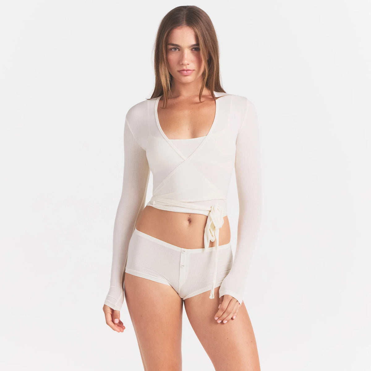 CLOUD SLEEP WRAP TOP | ECRU ON A MODEL SIDE VIEW @ | FOCUS: 0.0, 1.0, 0.9