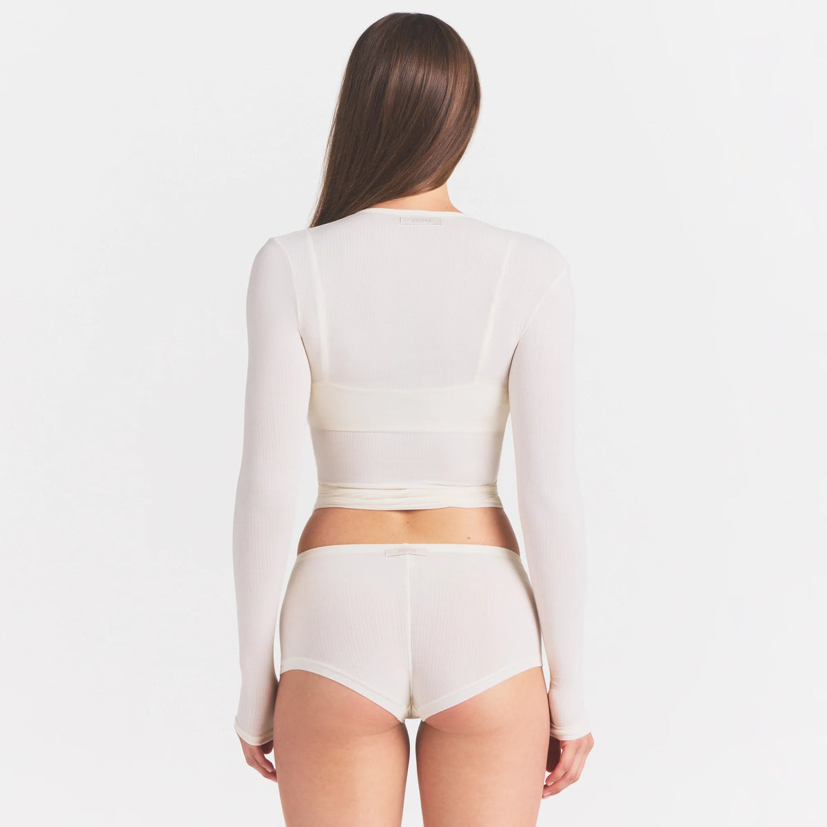 CLOUD SLEEP WRAP TOP | ECRU ON A MODEL SIDE VIEW @ | FOCUS: 0.0, 1.0, 0.9