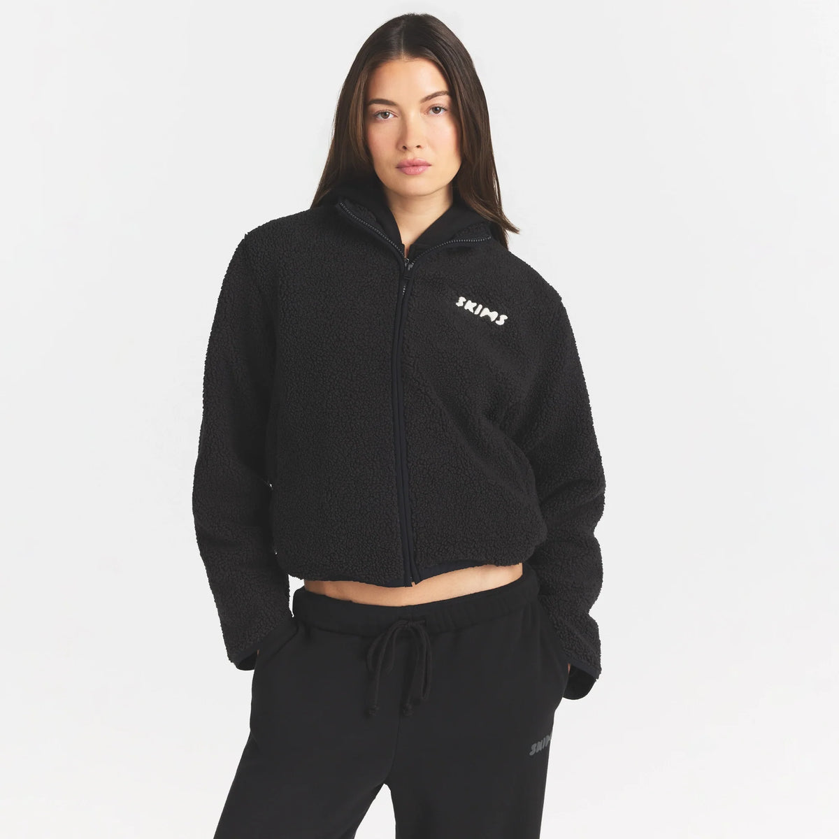 TEDDY BOXY ZIP UP JACKET | ONYX ON A MODEL SIDE VIEW @ | FOCUS: 0.0, 1.0, 0.9