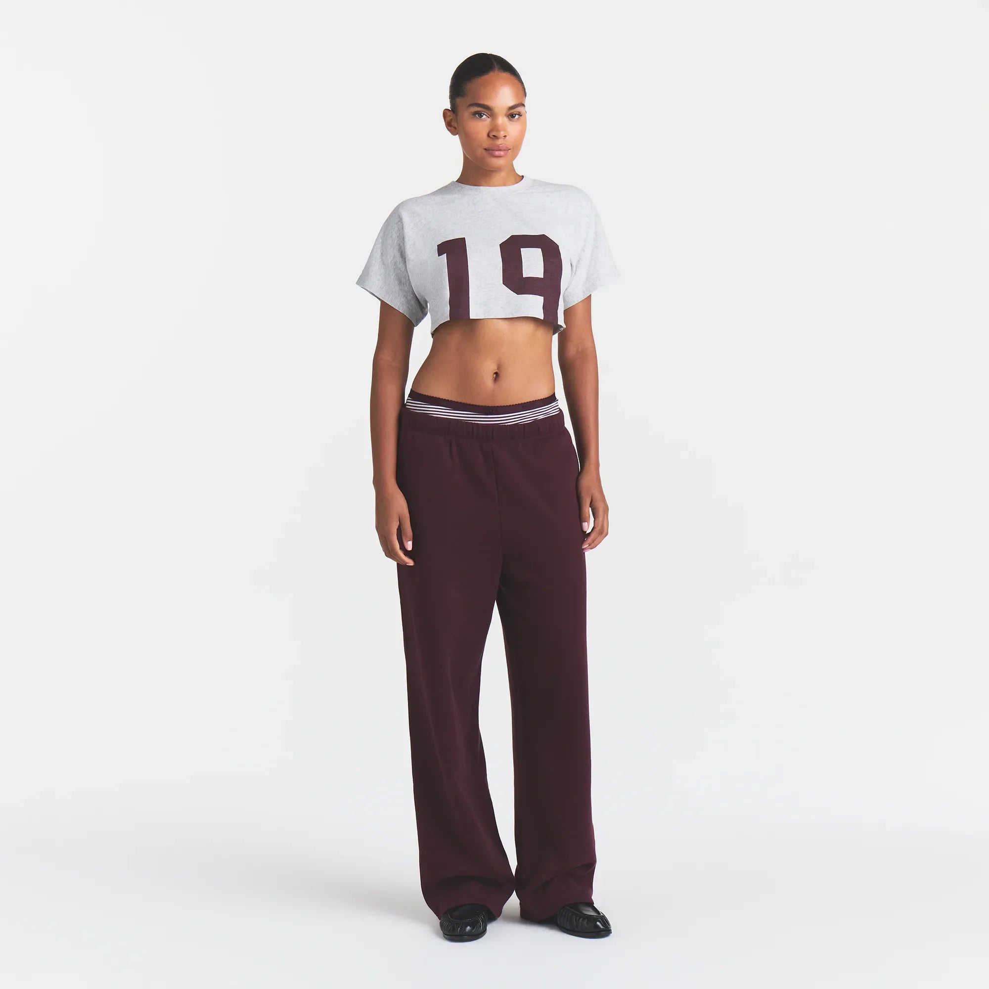 WORN IN JERSEY SUPER CROPPED T-SHIRT | CURRANT 19 PRINT ON A MODEL FRONT VIEW