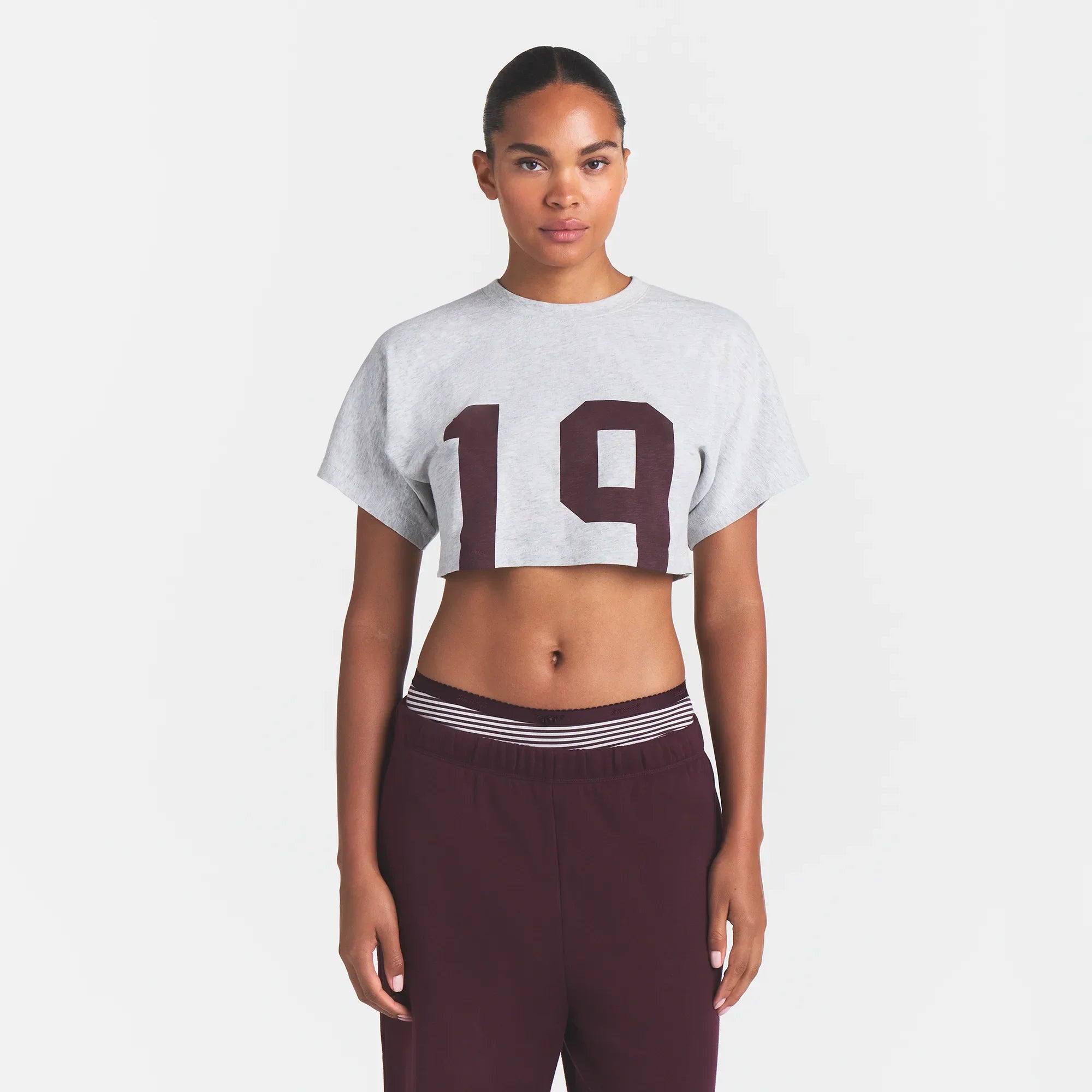 WORN IN JERSEY SUPER CROPPED T-SHIRT | CURRANT 19 PRINT ON A MODEL FRONT VIEW