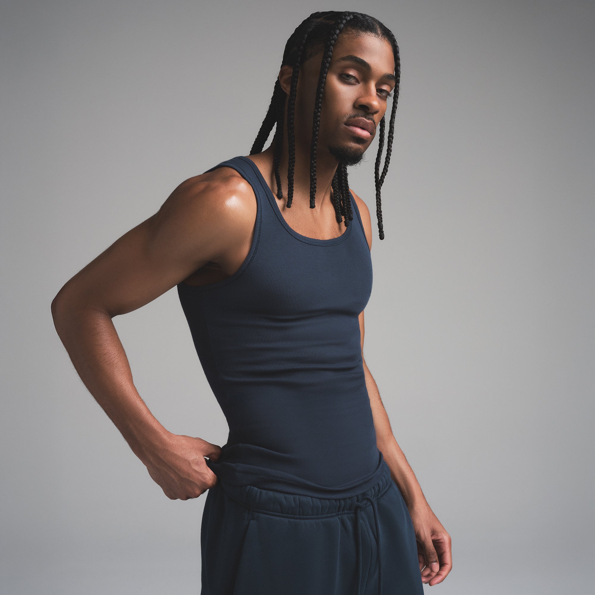 SKIMS COTTON MENS RIB TANK 3-PACK | ECRU MULTI ON A MODEL SIDE VIEW | FOCUS: 0.0, 1.0, 0.9