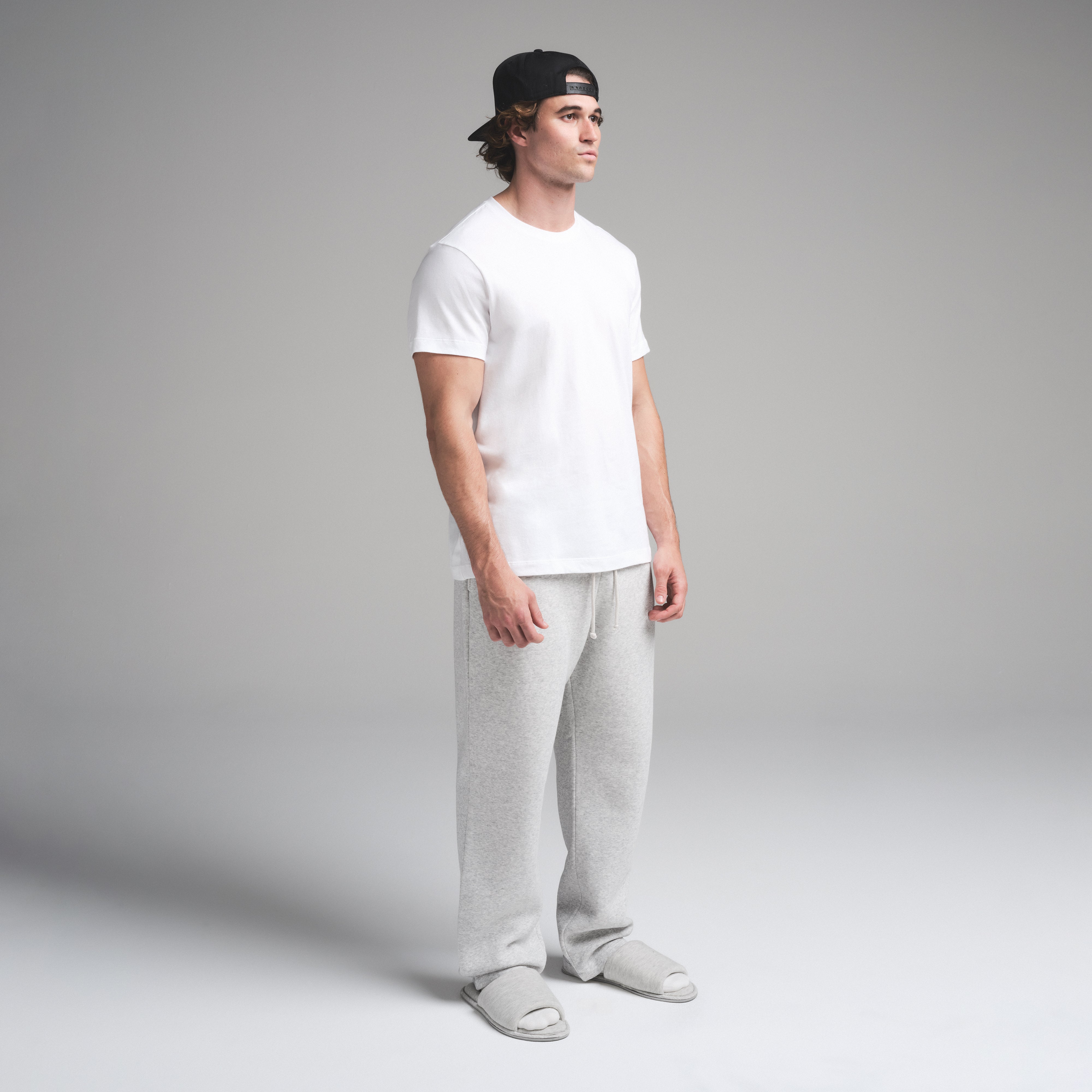 SKIMS COTTON MENS CLASSIC T-SHIRT | CHALK ON A MODEL SIDE VIEW | FOCUS: 0.0, 1.0, 0.9