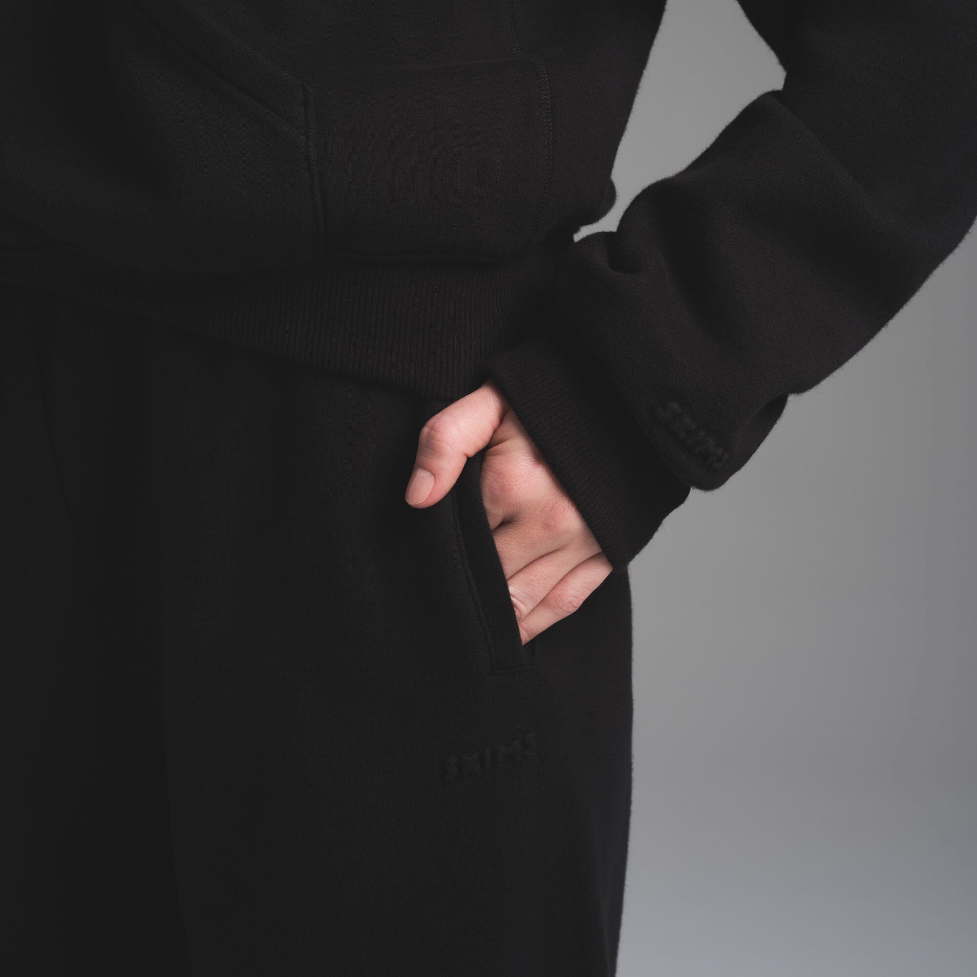 COTTON FLEECE CLASSIC ZIP UP HOODIE | ONYX ON A MODEL FRONT VIEW | FOCUS: 0.0, 1.0, 0.9